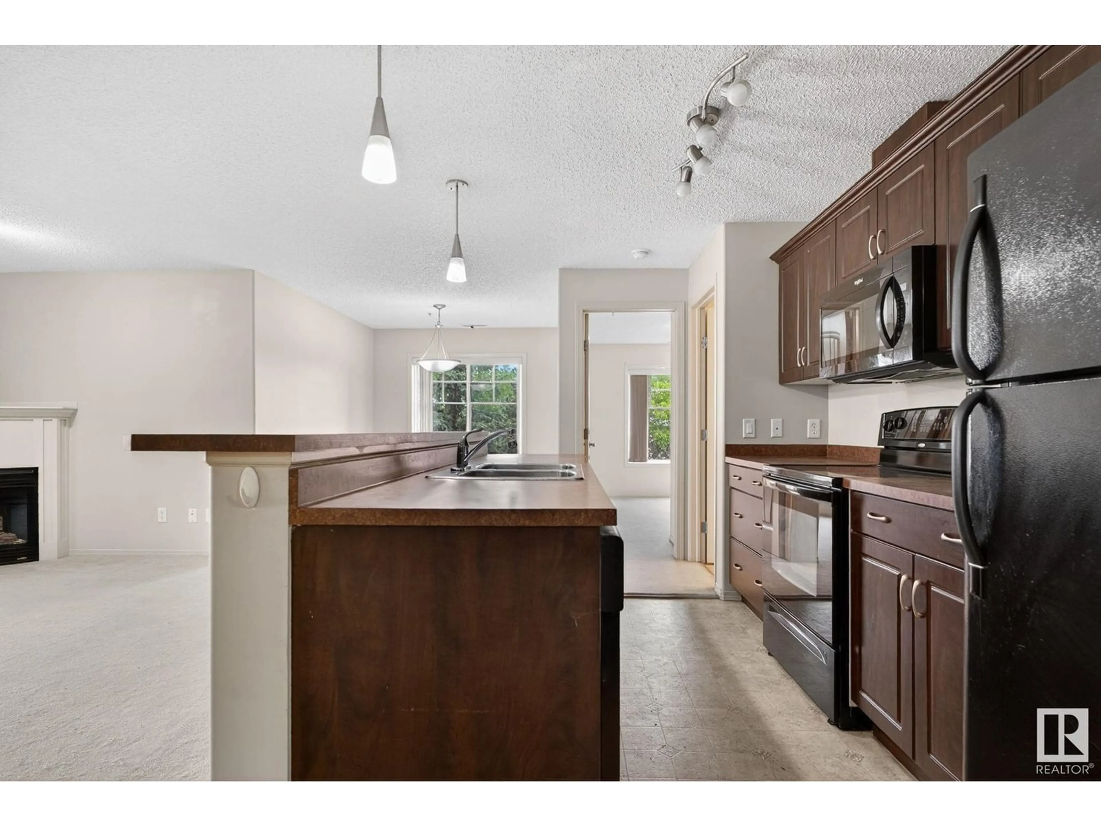 Open concept kitchen, unknown for #212 - 17415 99 AV, Edmonton Alberta T5T0W8
