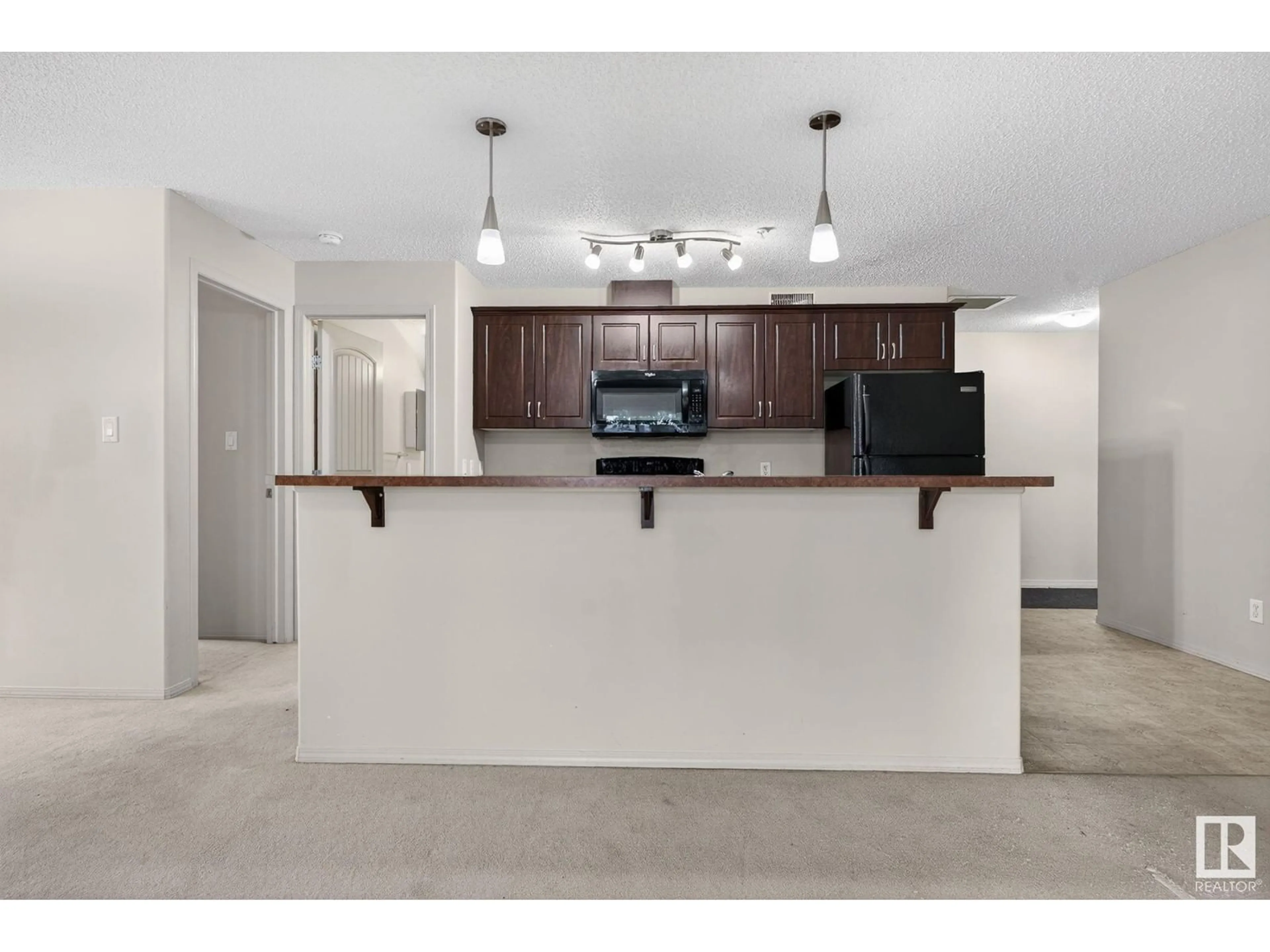 Open concept kitchen, unknown for #212 - 17415 99 AV, Edmonton Alberta T5T0W8