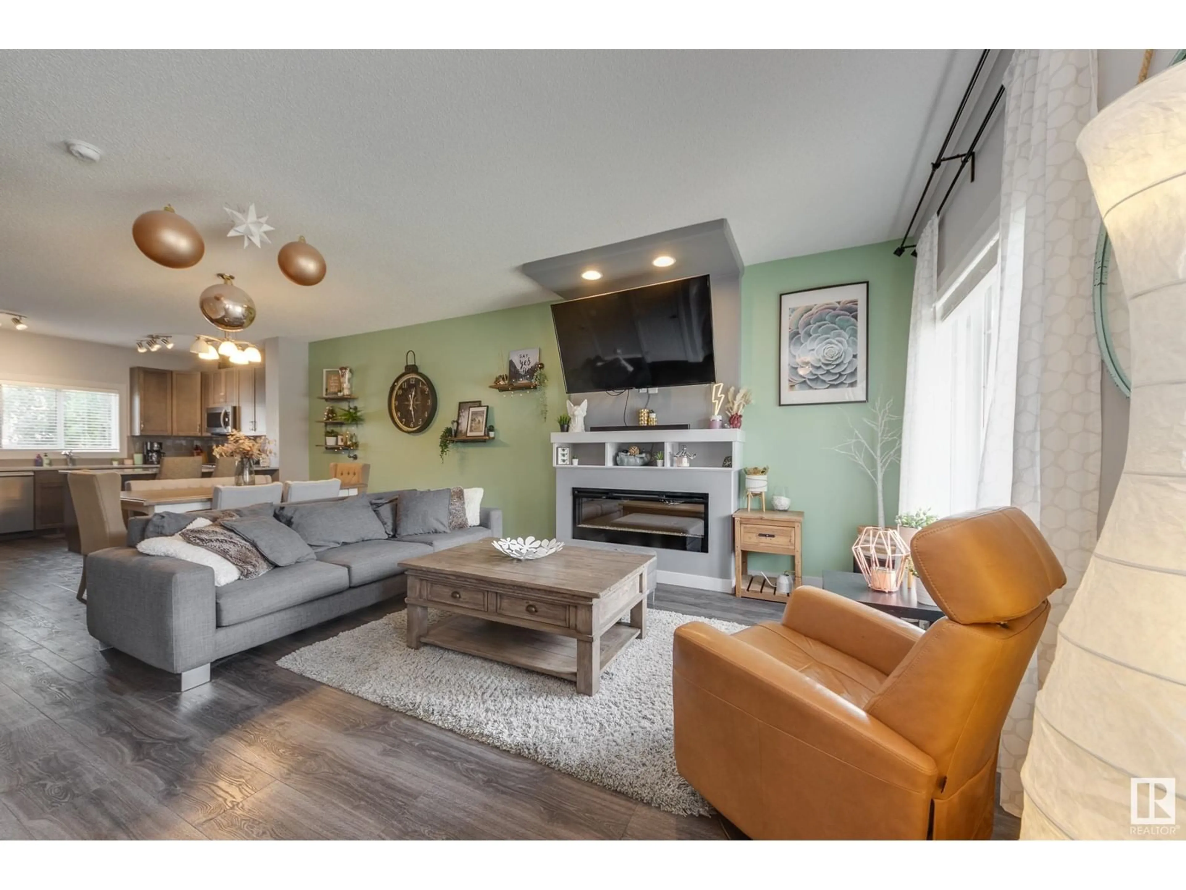 Living room with furniture, wood/laminate floor for 550 SECORD BV, Edmonton Alberta T5T7B8