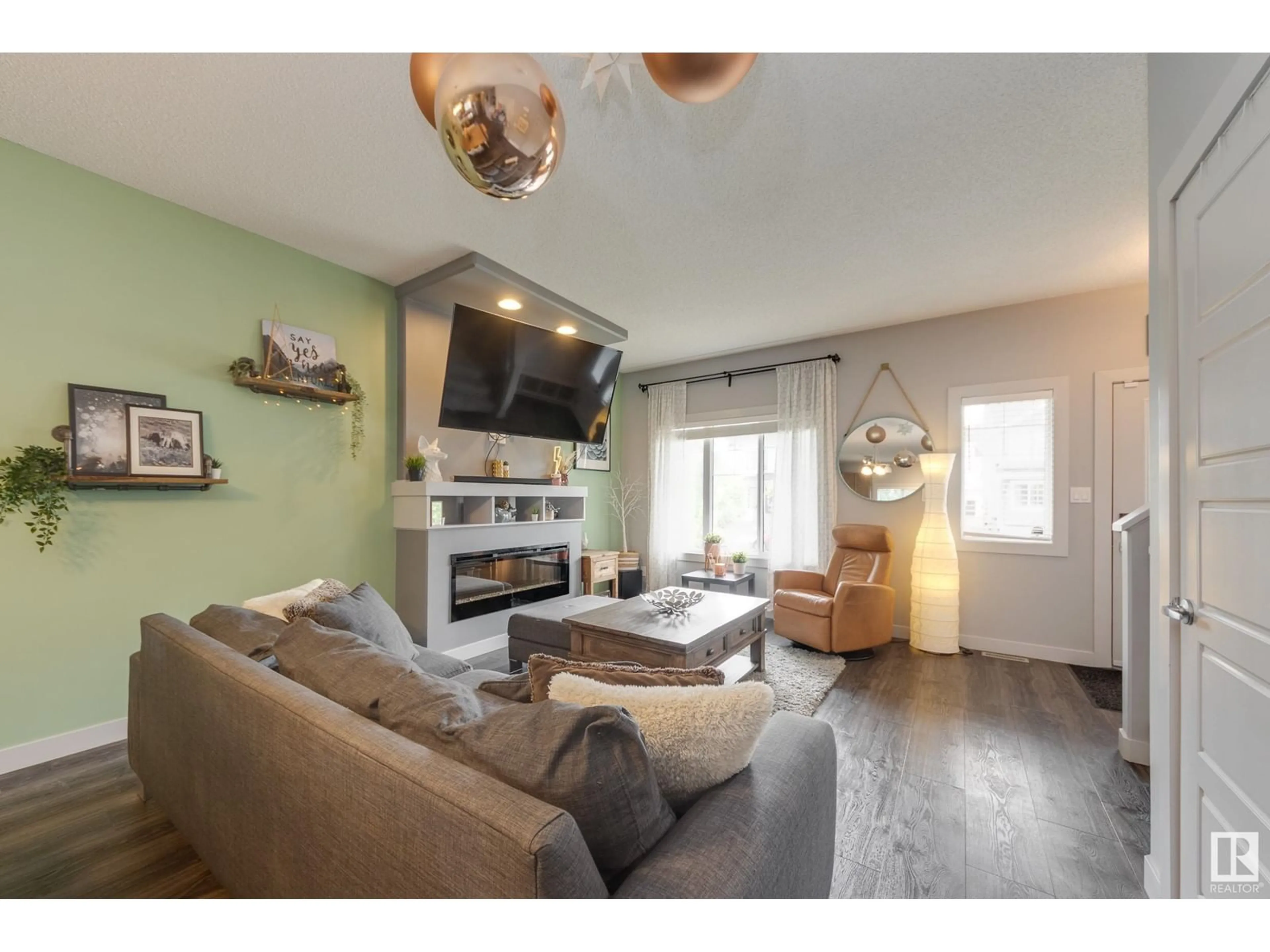 Living room with furniture, wood/laminate floor for 550 SECORD BV, Edmonton Alberta T5T7B8