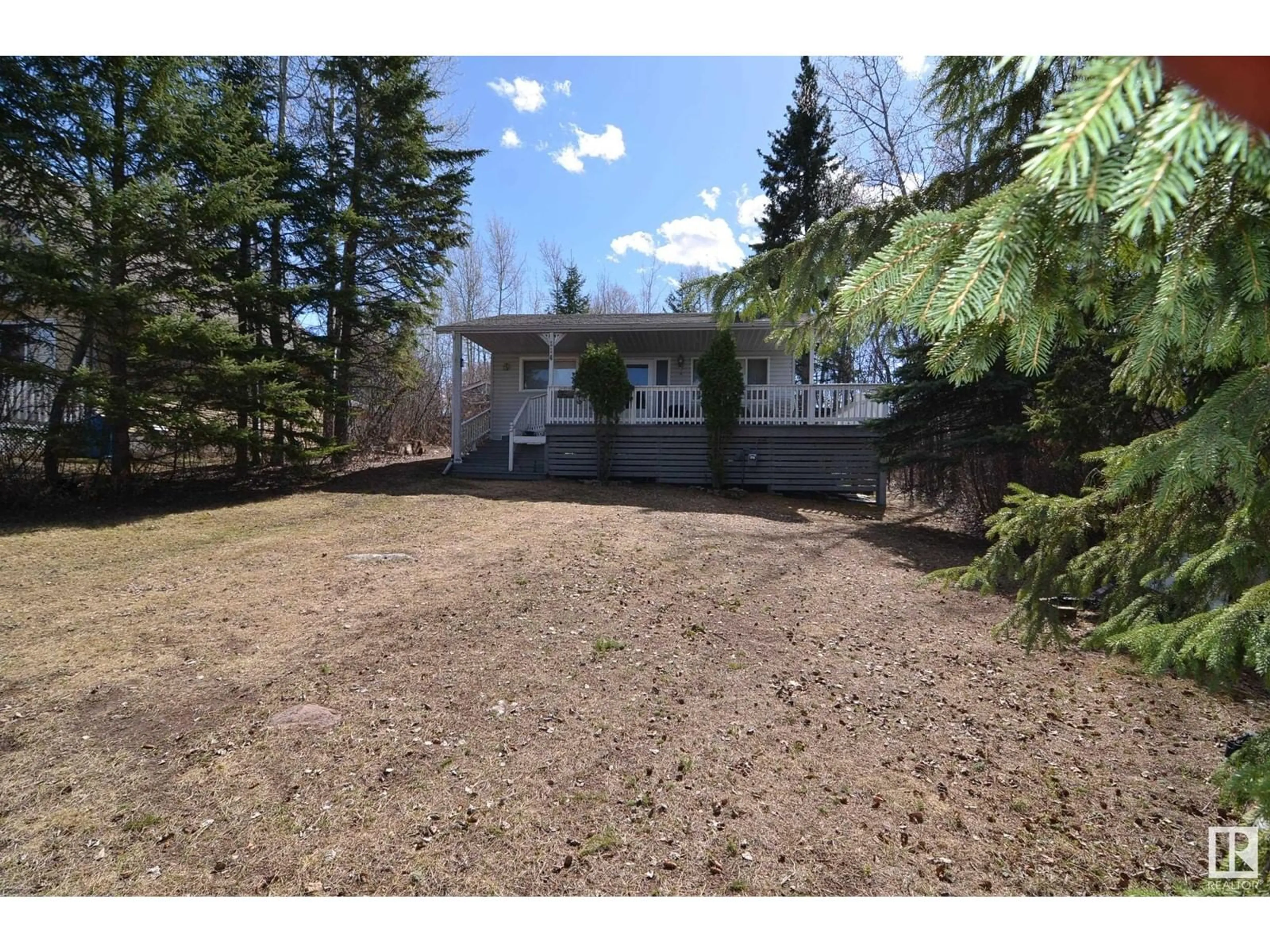 A pic from outside/outdoor area/front of a property/back of a property/a pic from drone, street for 110 - 5415 TWP RD 594, Rural Barrhead County Alberta T7N1N3