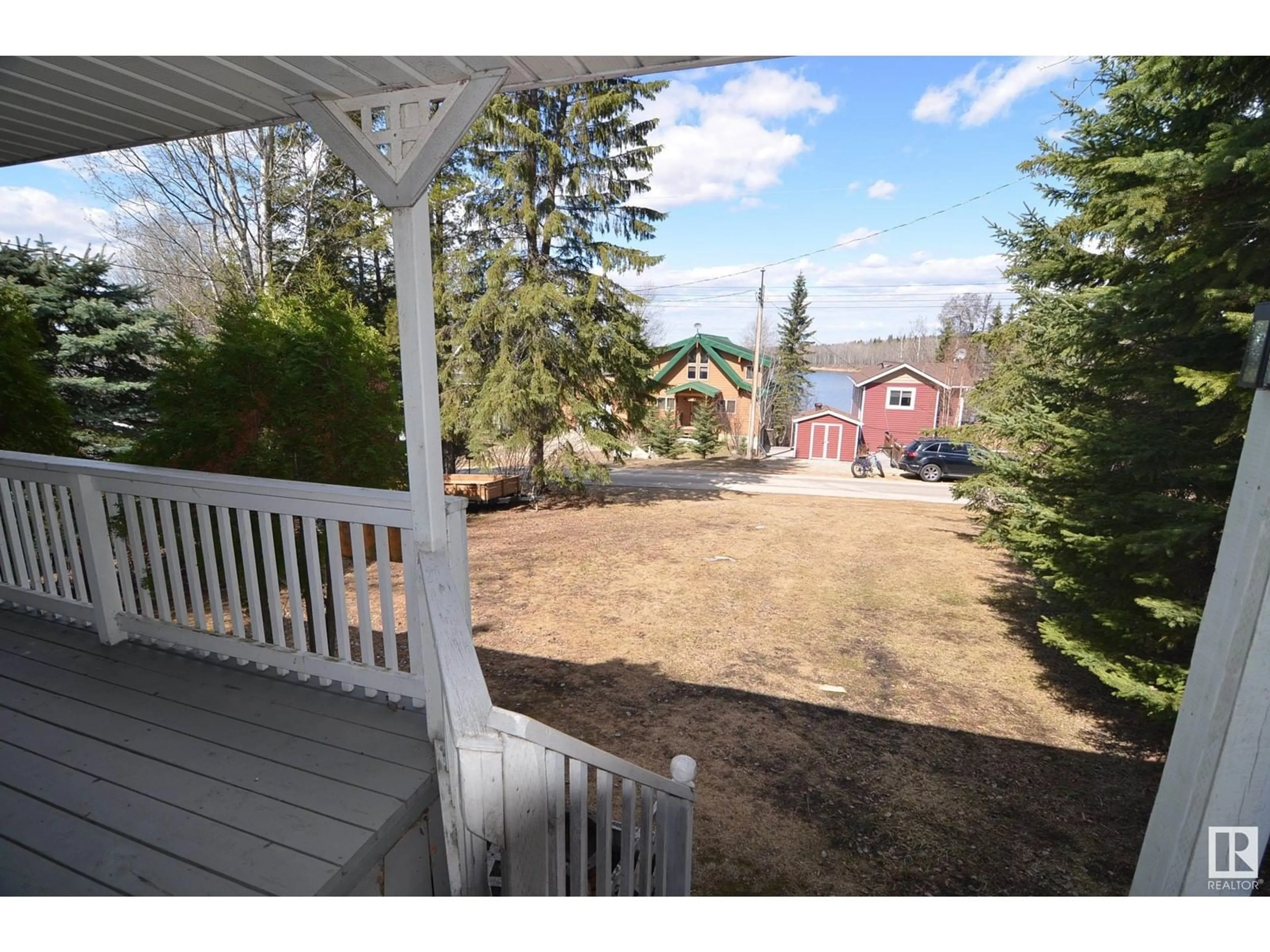 A pic from outside/outdoor area/front of a property/back of a property/a pic from drone, unknown for 110 - 5415 TWP RD 594, Rural Barrhead County Alberta T7N1N3