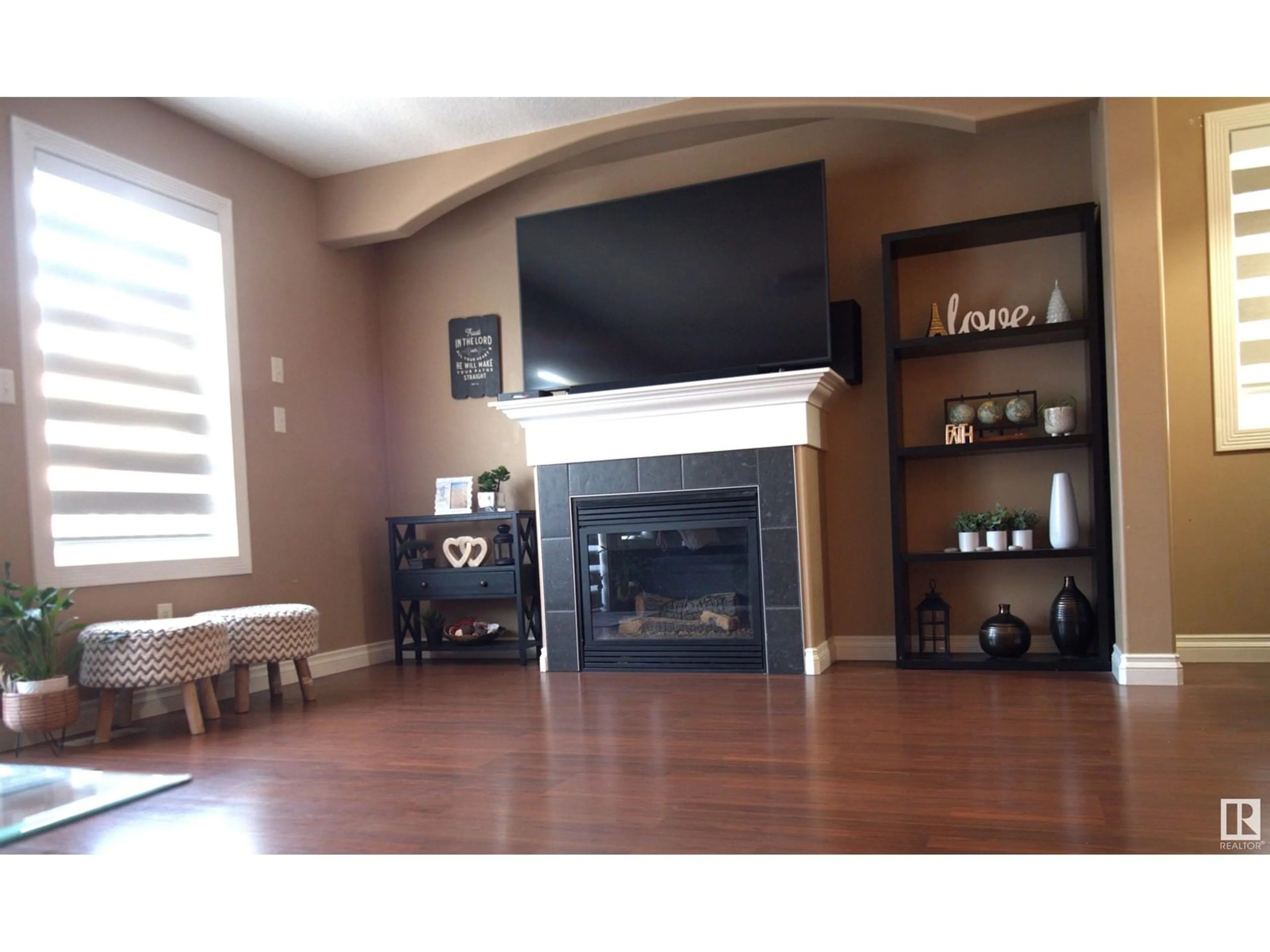 Living room with furniture, wood/laminate floor for 5962 164 AV, Edmonton Alberta T5Y0B2