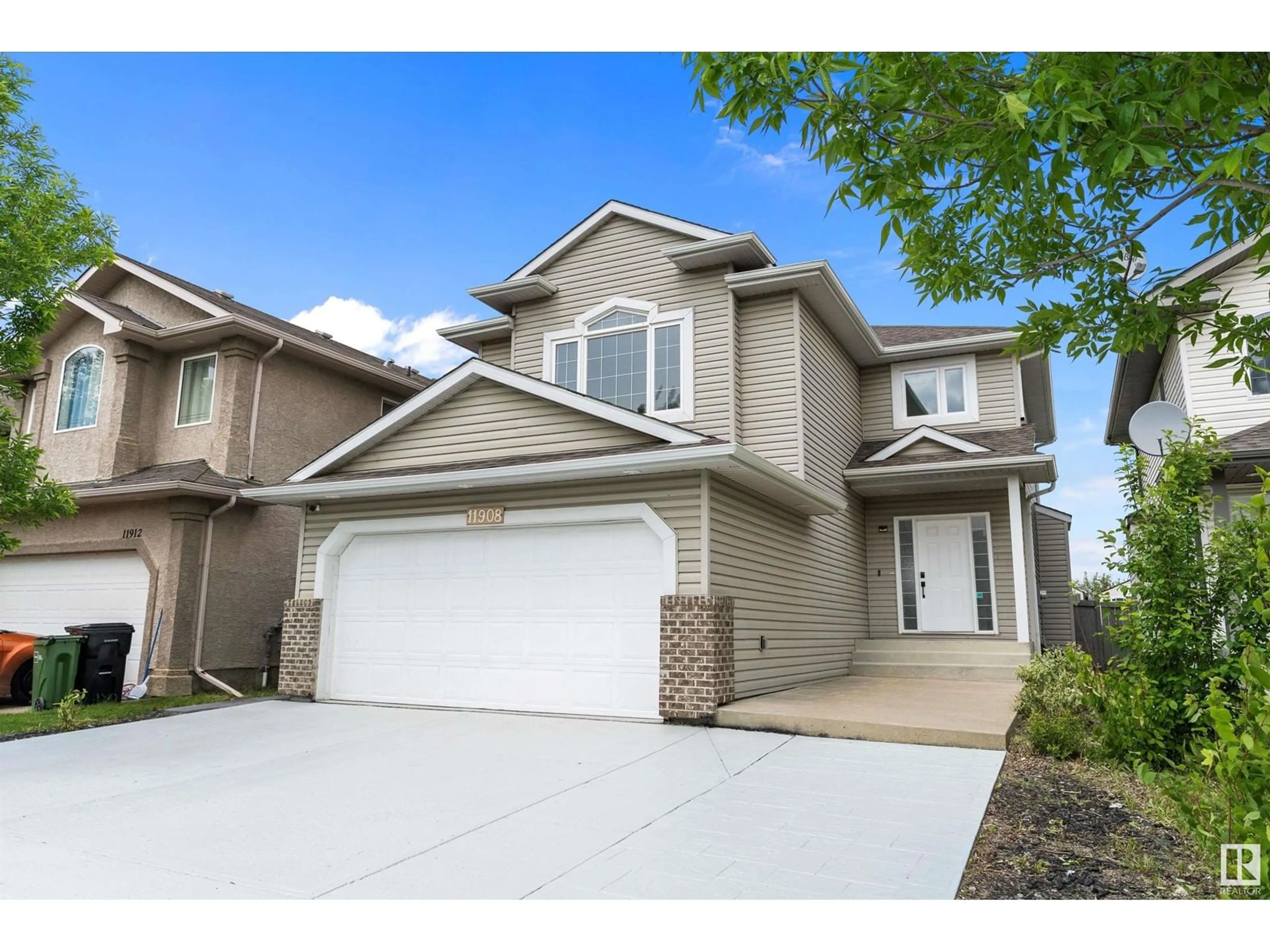 Home with vinyl exterior material, street for NW - 11908 175 AV, Edmonton Alberta T5X0A5