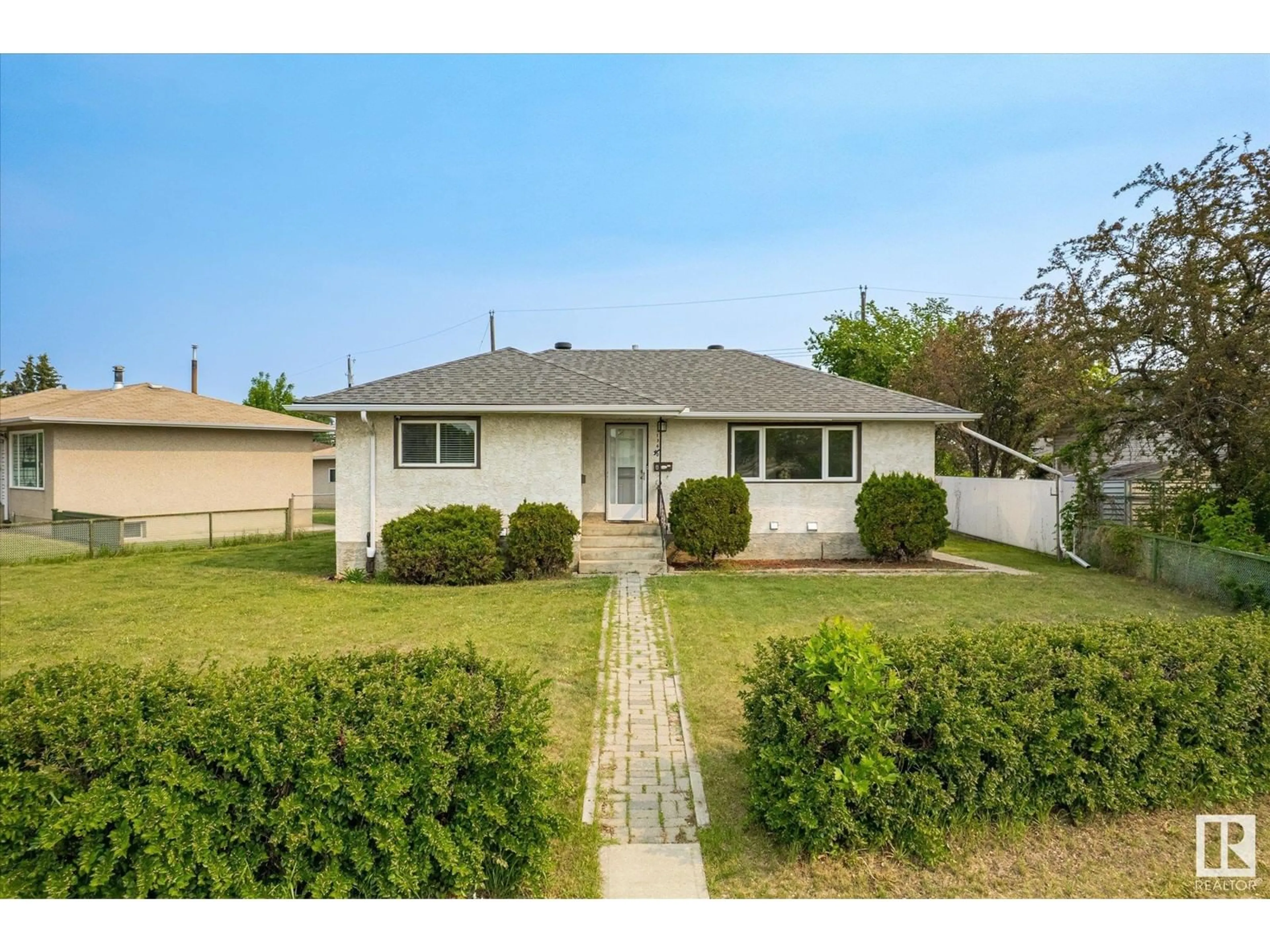 A pic from outside/outdoor area/front of a property/back of a property/a pic from drone, street for 13640 135 AV NW, Edmonton Alberta T5L3Y6