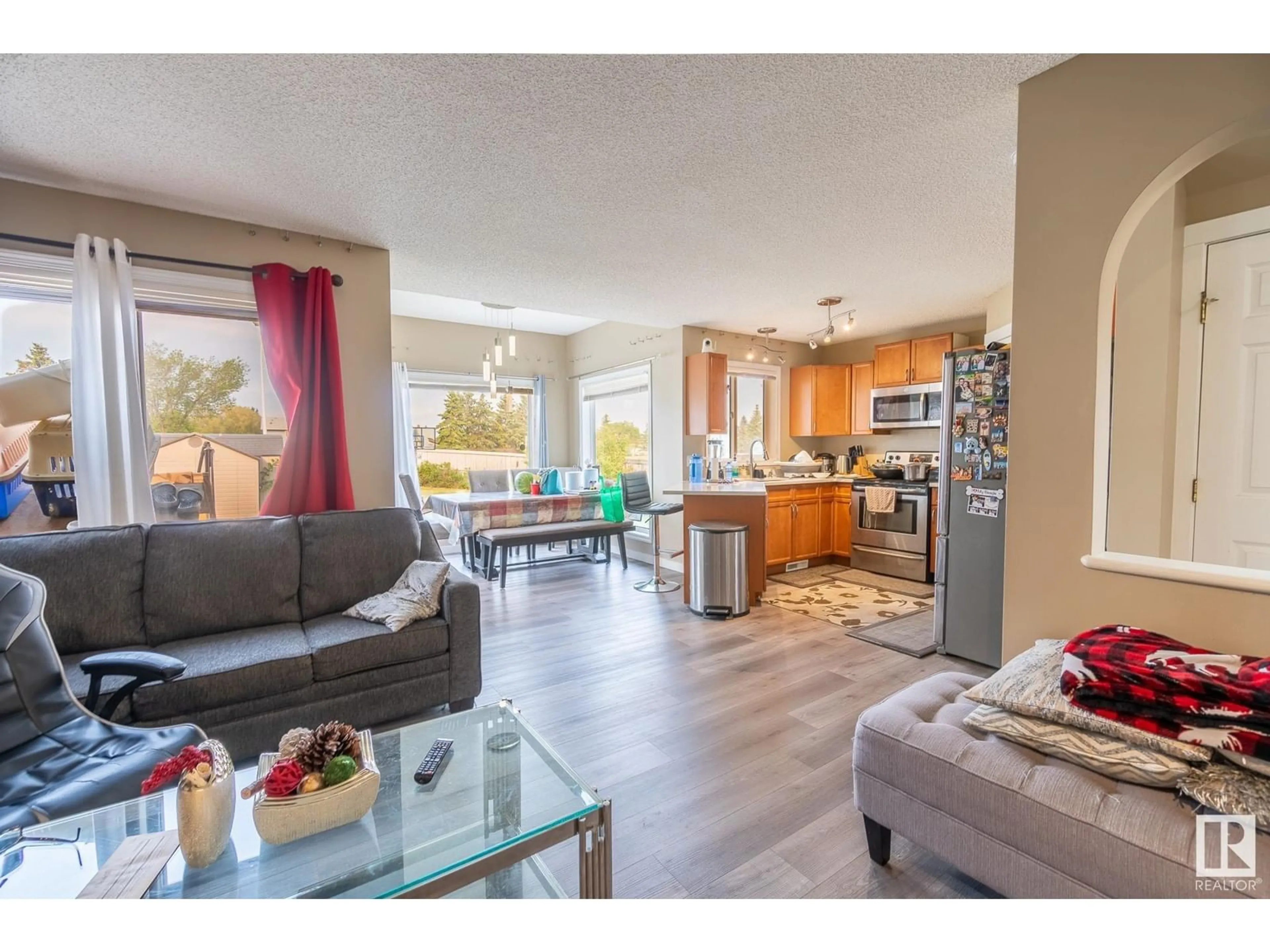 Open concept kitchen, wood/laminate floor for NW - 13803 37 ST, Edmonton Alberta T5Y3G5