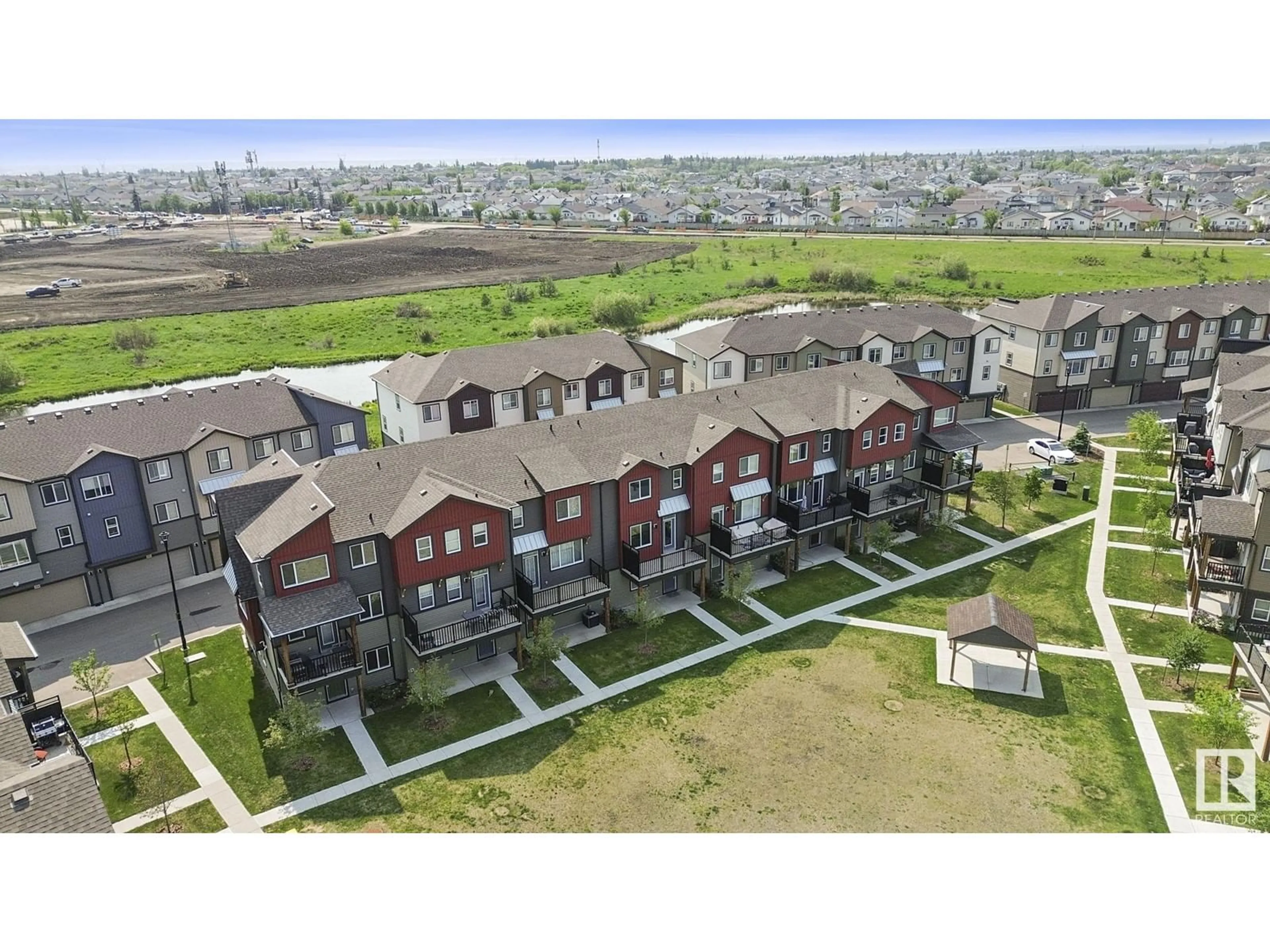 A pic from outside/outdoor area/front of a property/back of a property/a pic from drone, unknown for 82 16903 68ST NW, Edmonton Alberta T5Z0R1