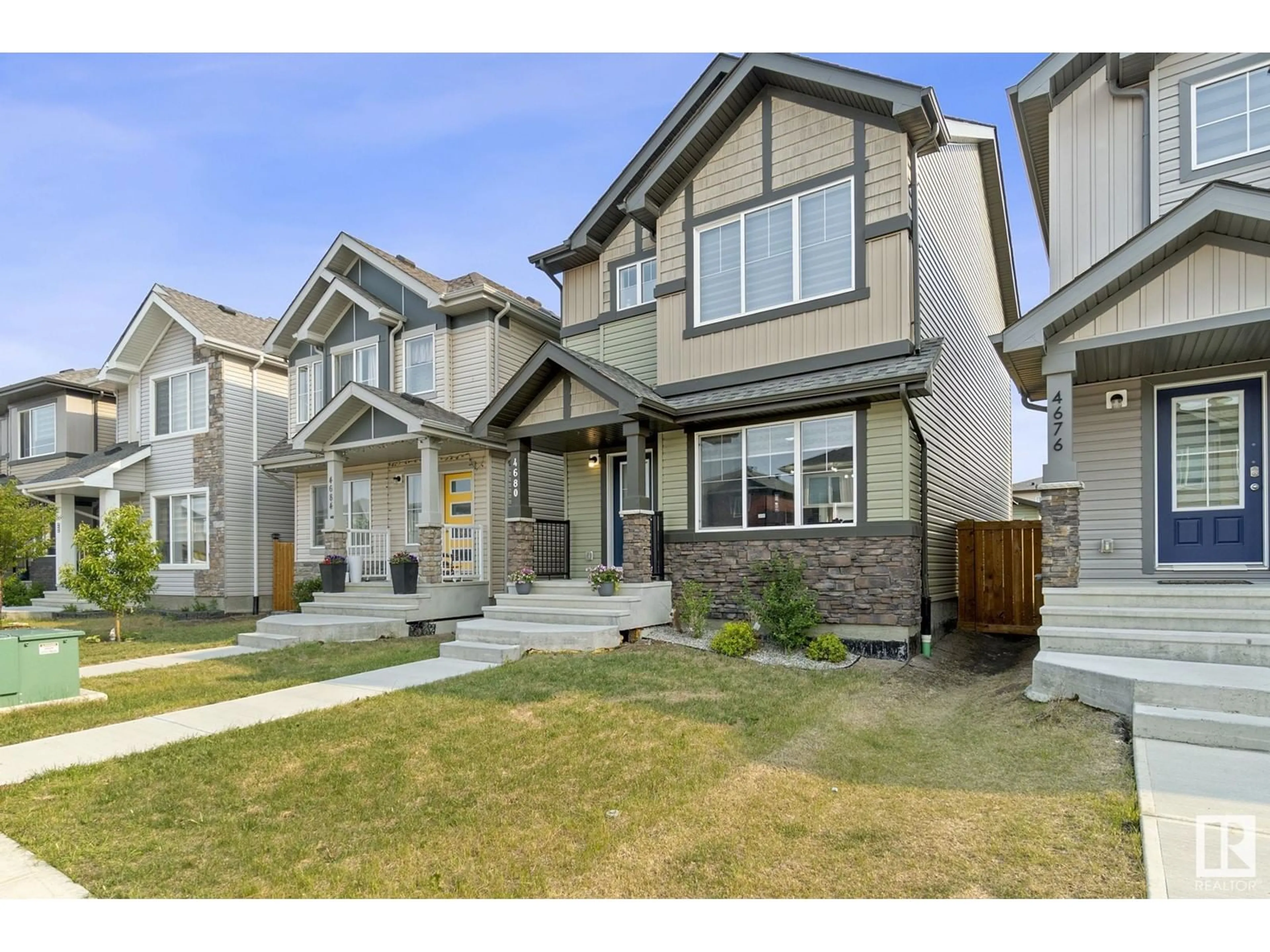 Home with vinyl exterior material, street for NW - 4680 175 AVE, Edmonton Alberta T5Y3Z8