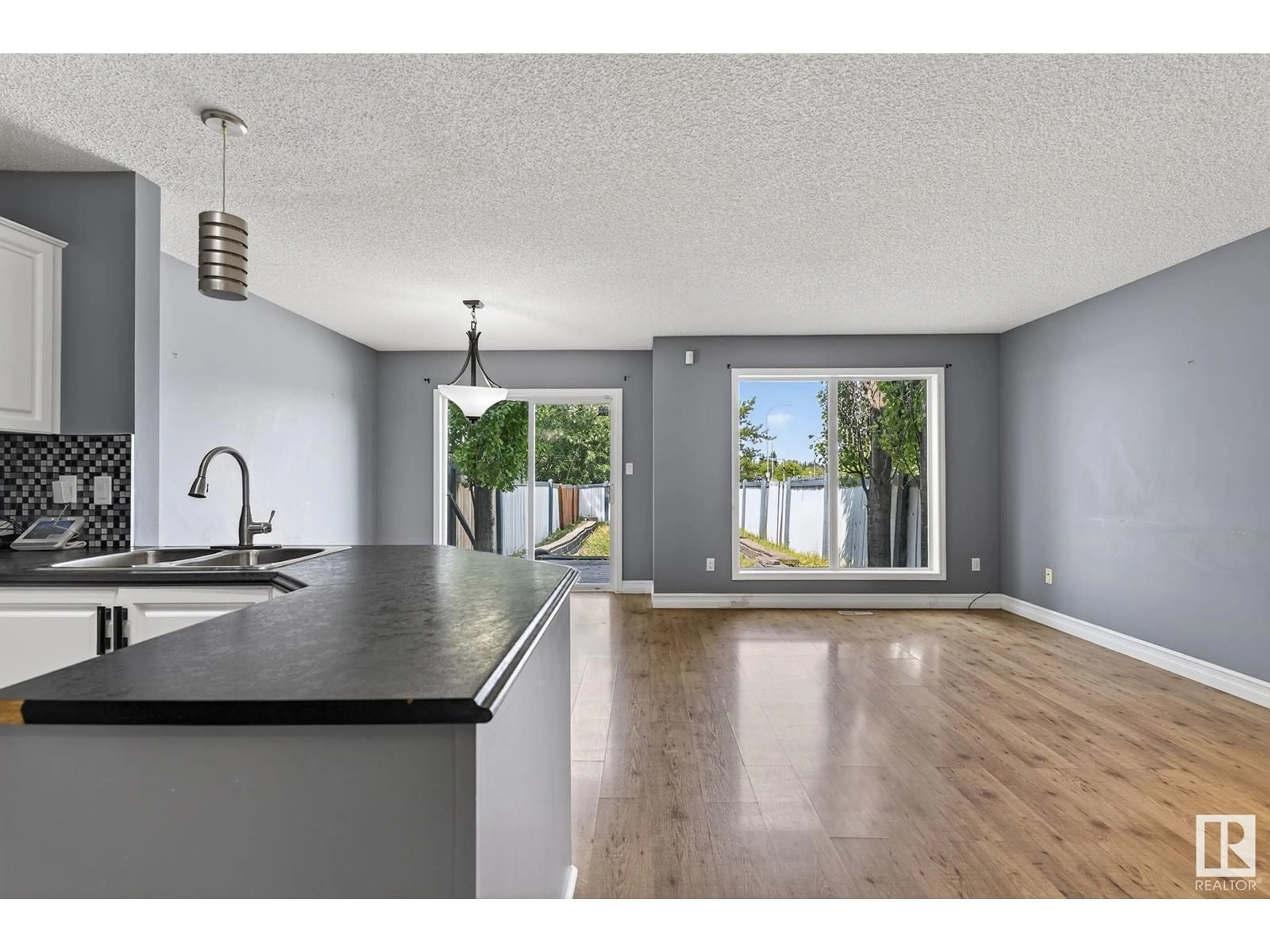 Open concept kitchen, wood/laminate floor for 5410 CREEKSIDE PT, Stony Plain Alberta T7Z2A4
