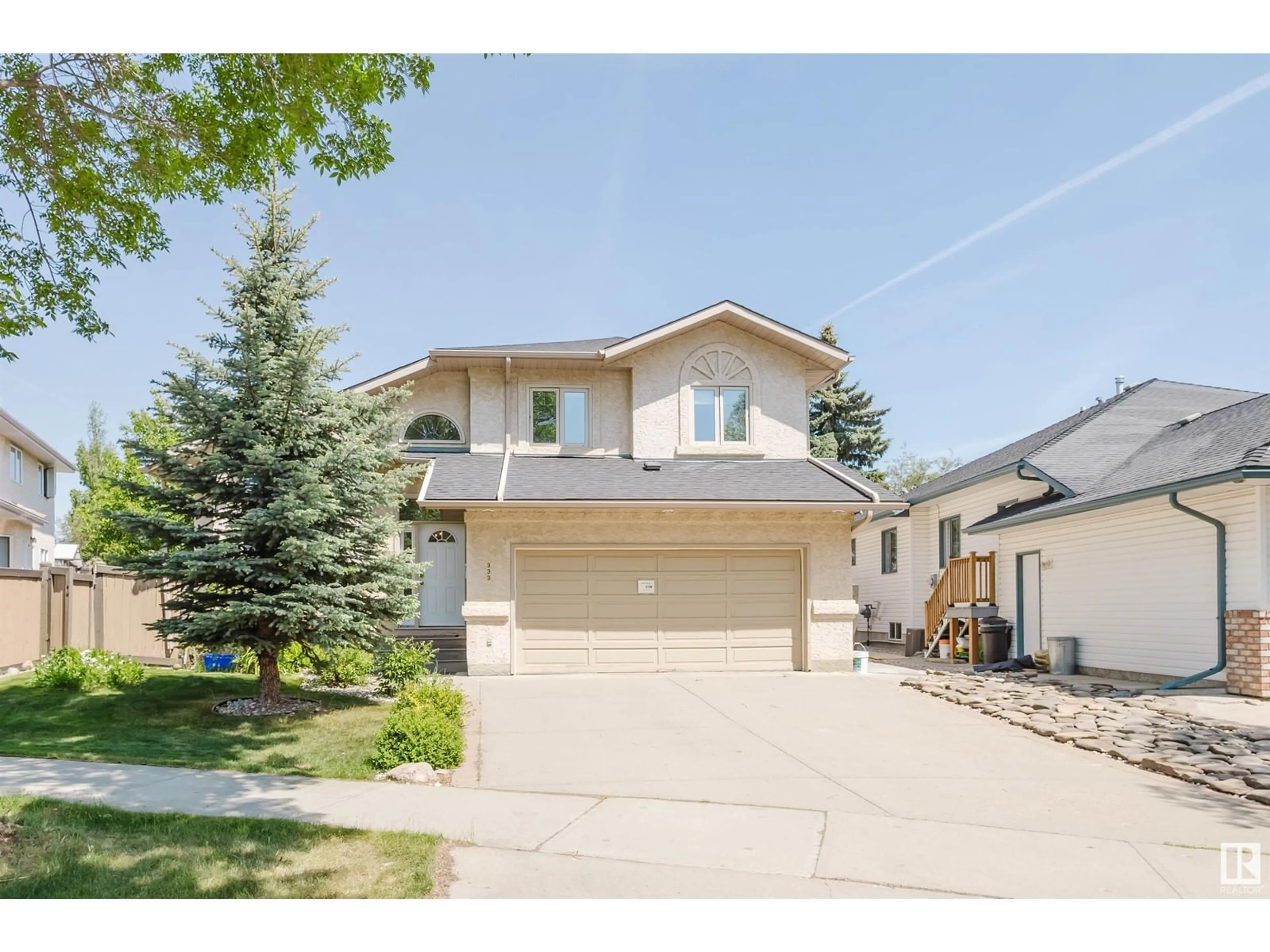 Home with vinyl exterior material, street for 333 BURTON RD, Edmonton Alberta T6R2G7