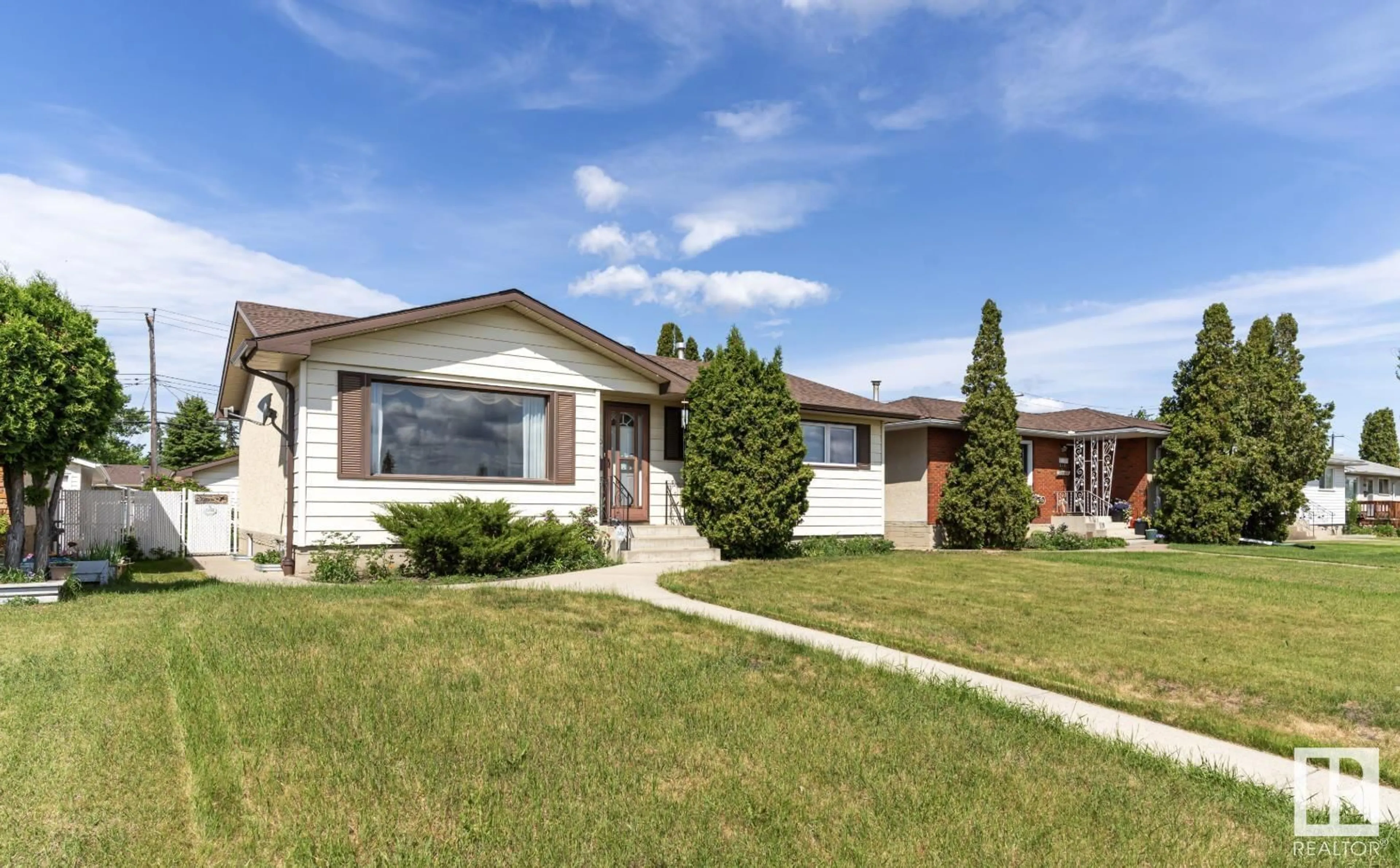 Home with vinyl exterior material, street for 13320 94 STREET, Edmonton Alberta T5E3V8