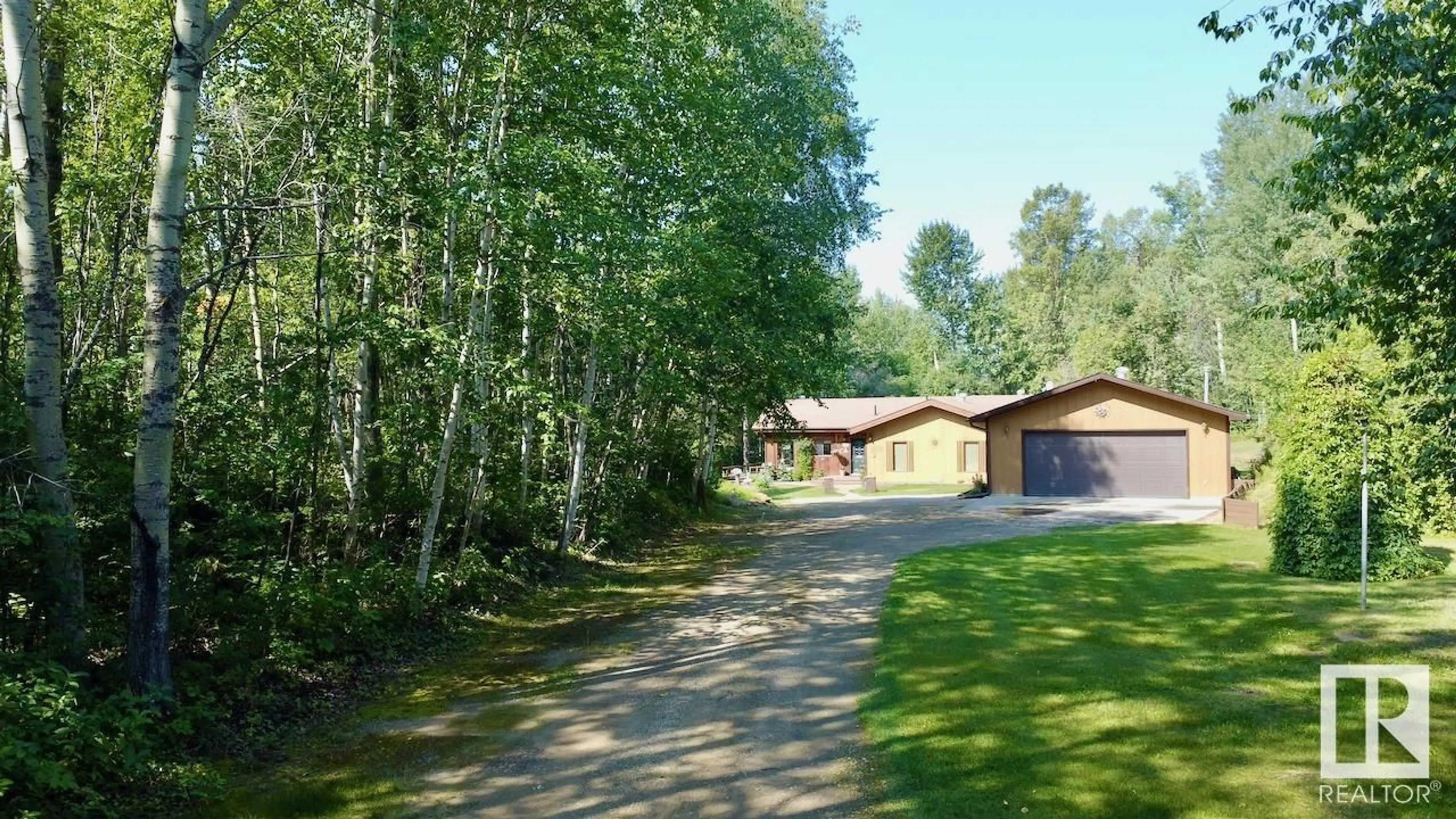 A pic from outside/outdoor area/front of a property/back of a property/a pic from drone, forest/trees view for A - 4502 LAKESHORE RD, Rural Parkland County Alberta T0E2K0