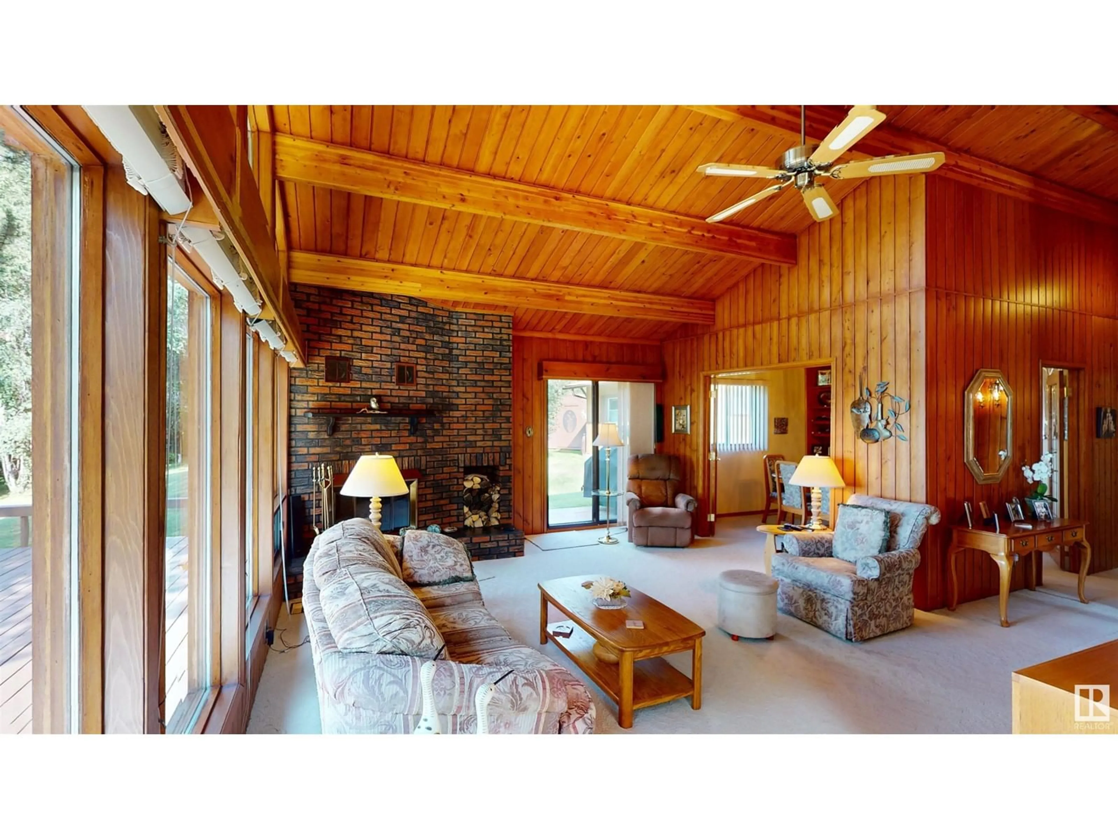 Living room with furniture, wood/laminate floor for A - 4502 LAKESHORE RD, Rural Parkland County Alberta T0E2K0