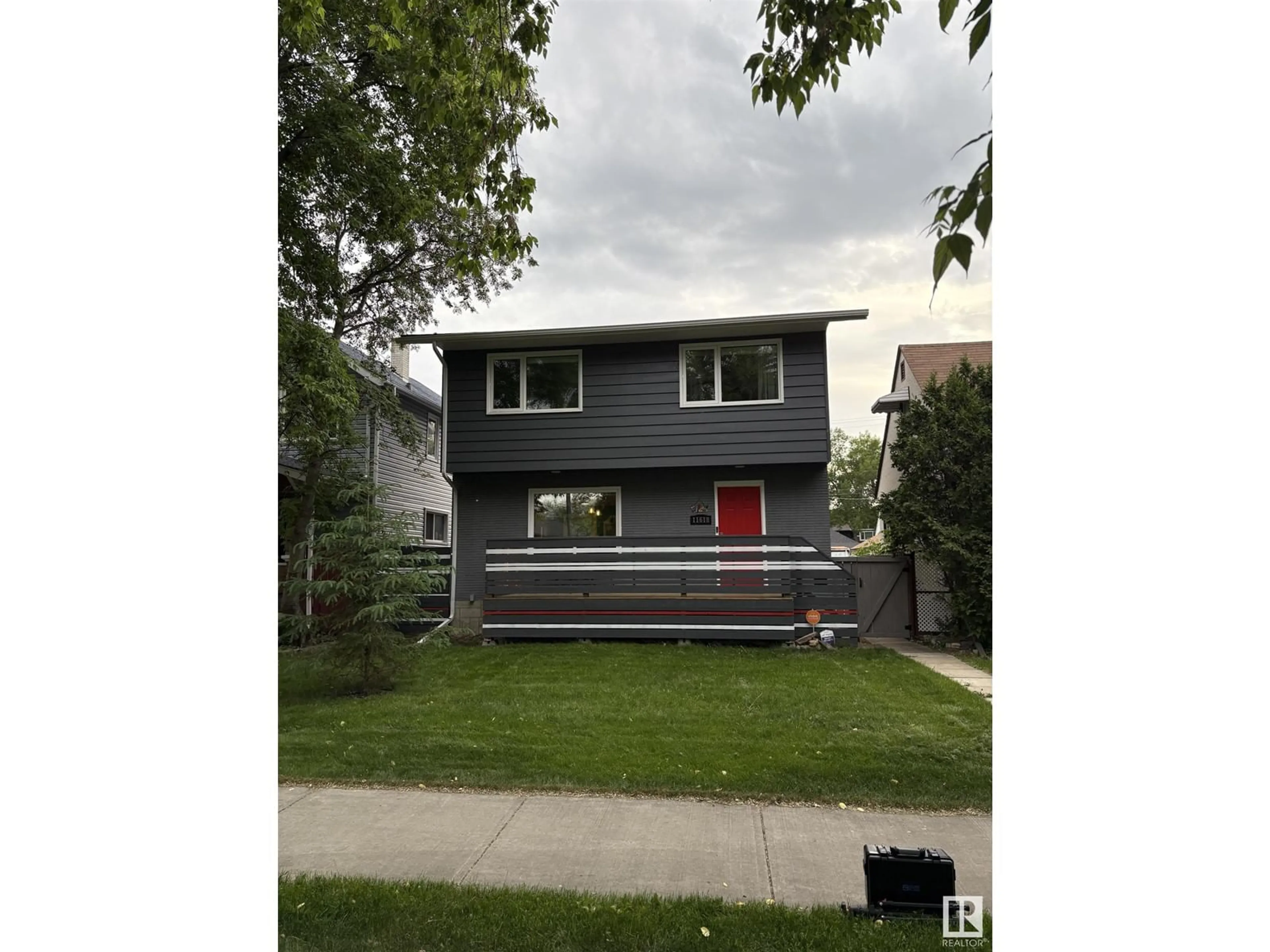 Home with vinyl exterior material, street for 11618 88 ST, Edmonton Alberta T5B3R4