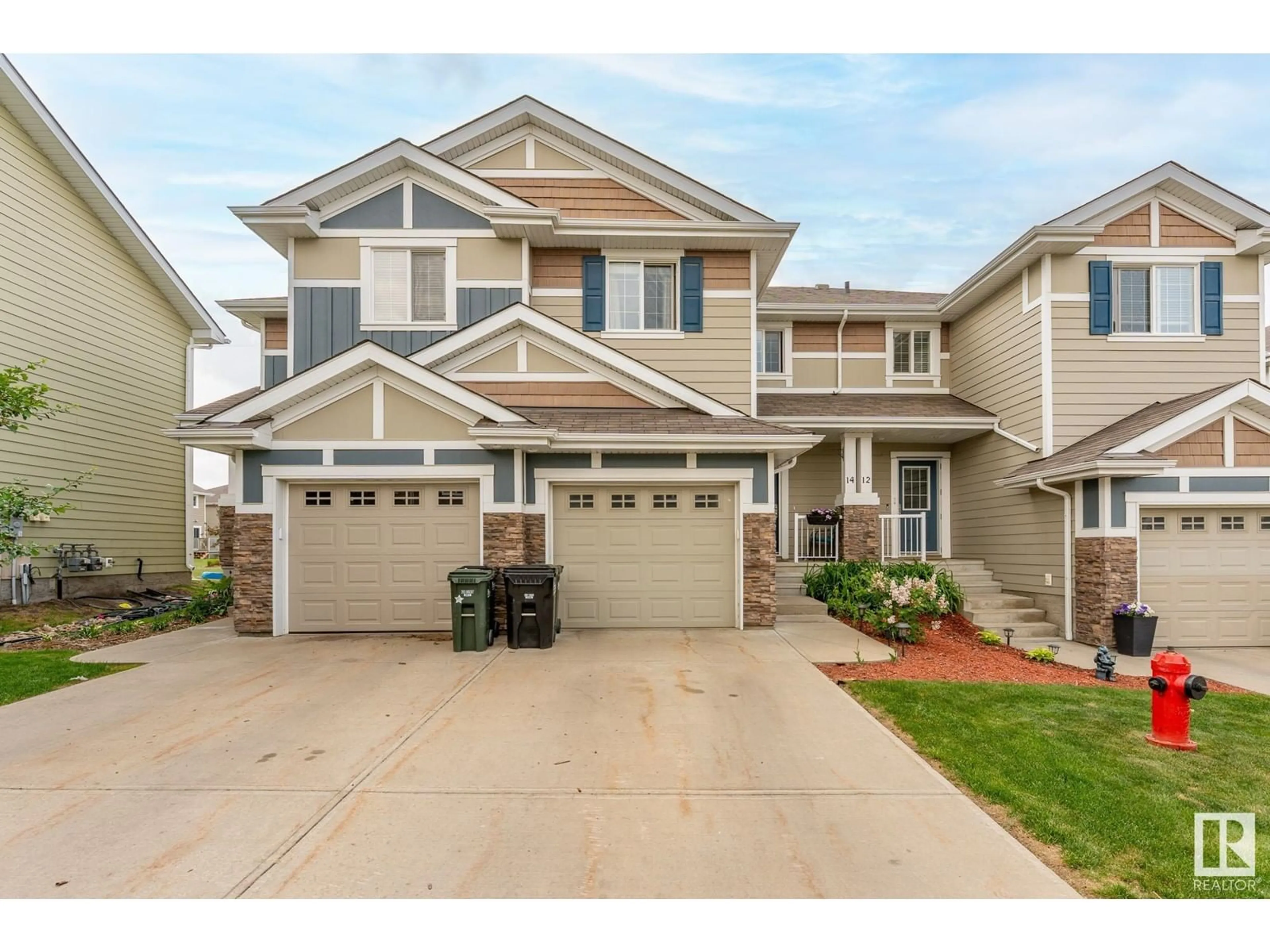 Home with vinyl exterior material, street for 14 - 219 CHARLOTTE WY, Sherwood Park Alberta T8H0T3