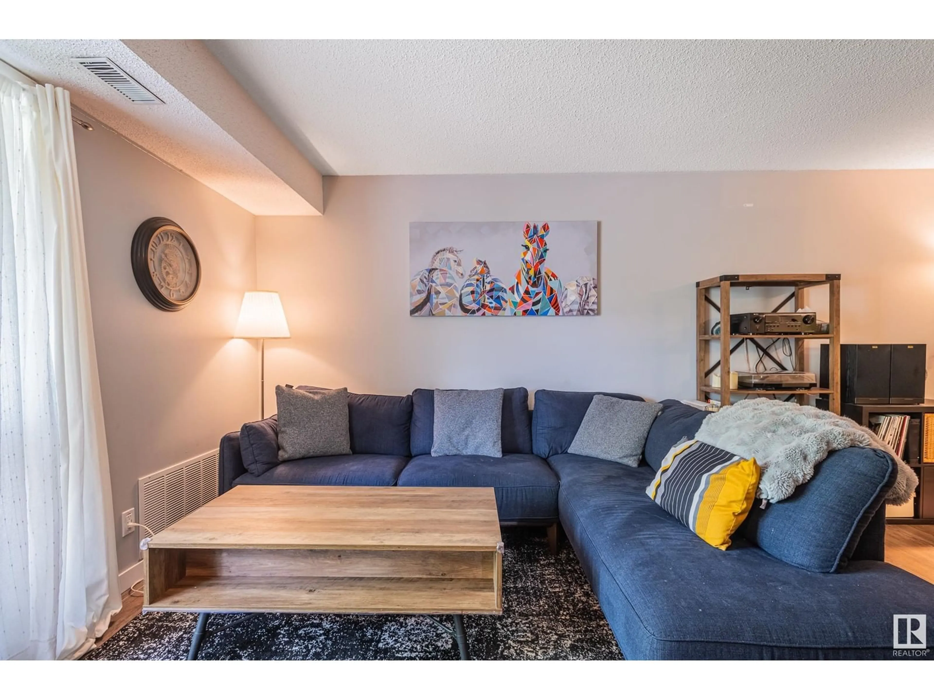 Living room with furniture, wood/laminate floor for 2003 SADDLEBACK RD, Edmonton Alberta T5J4T4