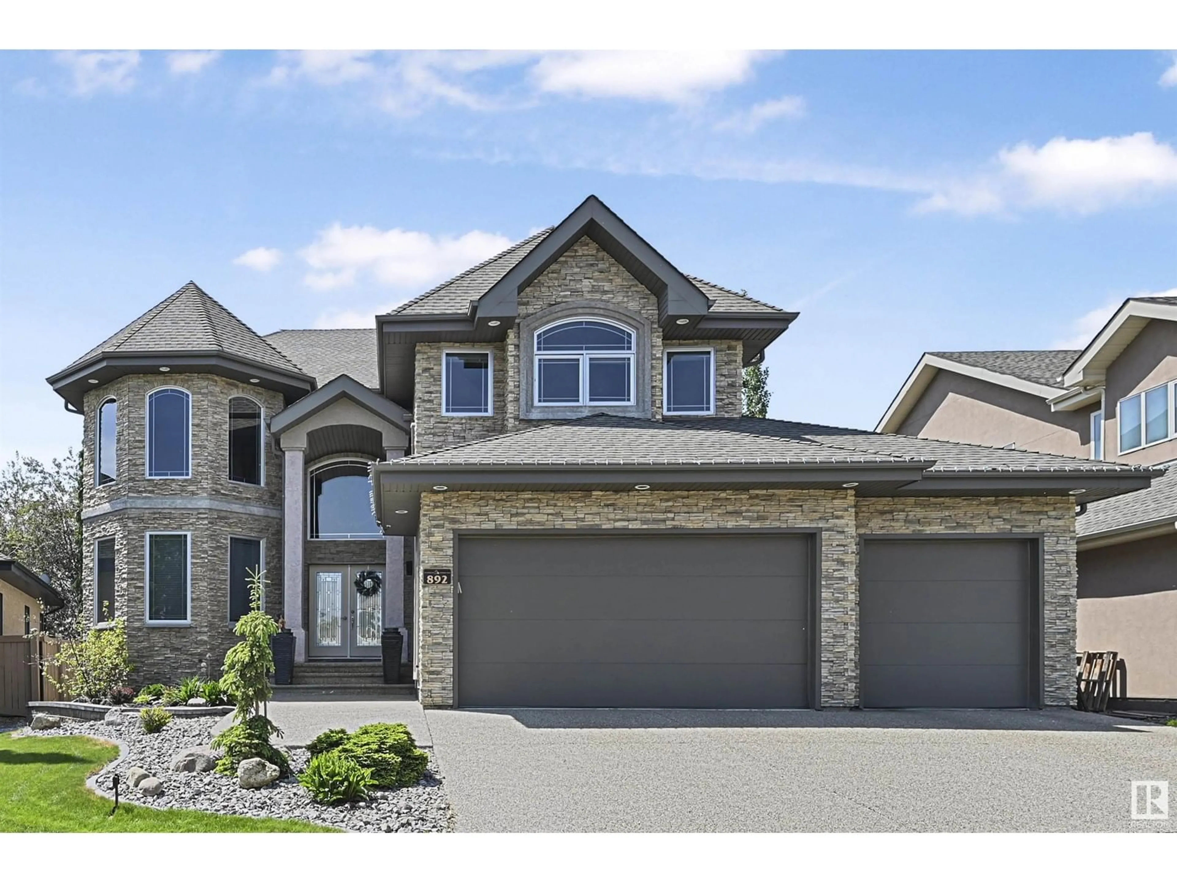 Home with brick exterior material, street for 892 HOLLANDS LD, Edmonton Alberta T6R3L2