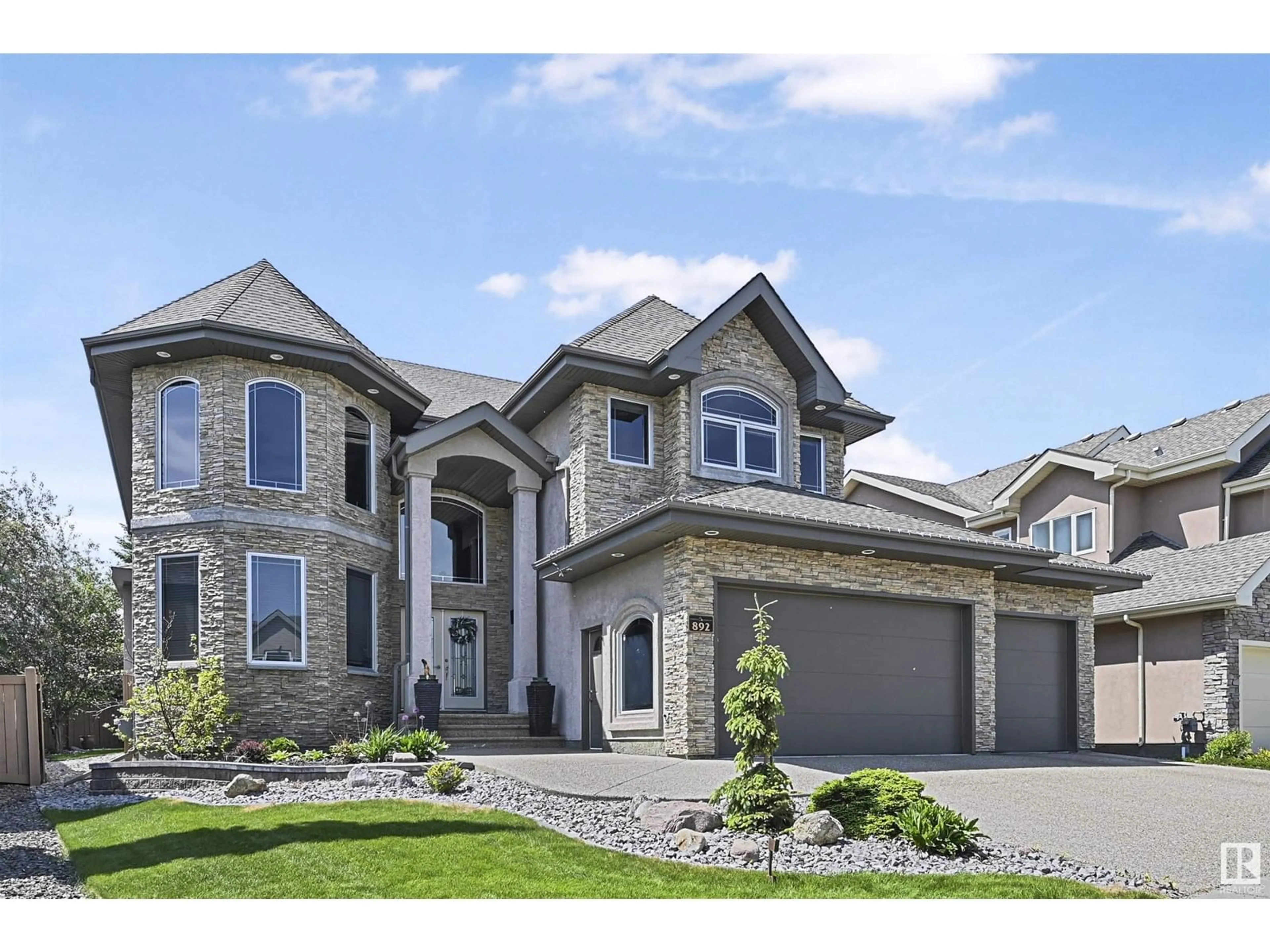 Home with brick exterior material, street for 892 HOLLANDS LD, Edmonton Alberta T6R3L2