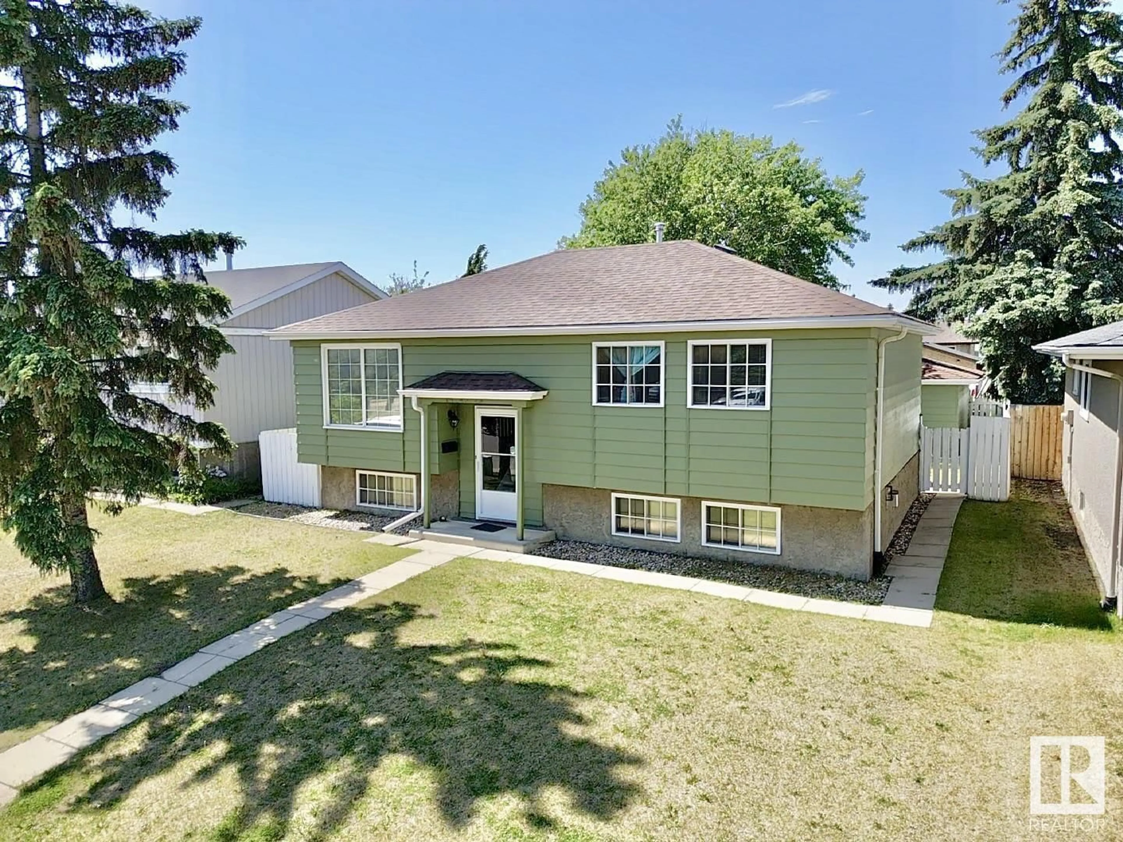 Home with vinyl exterior material, street for 14240 23 ST, Edmonton Alberta T5Y1E8