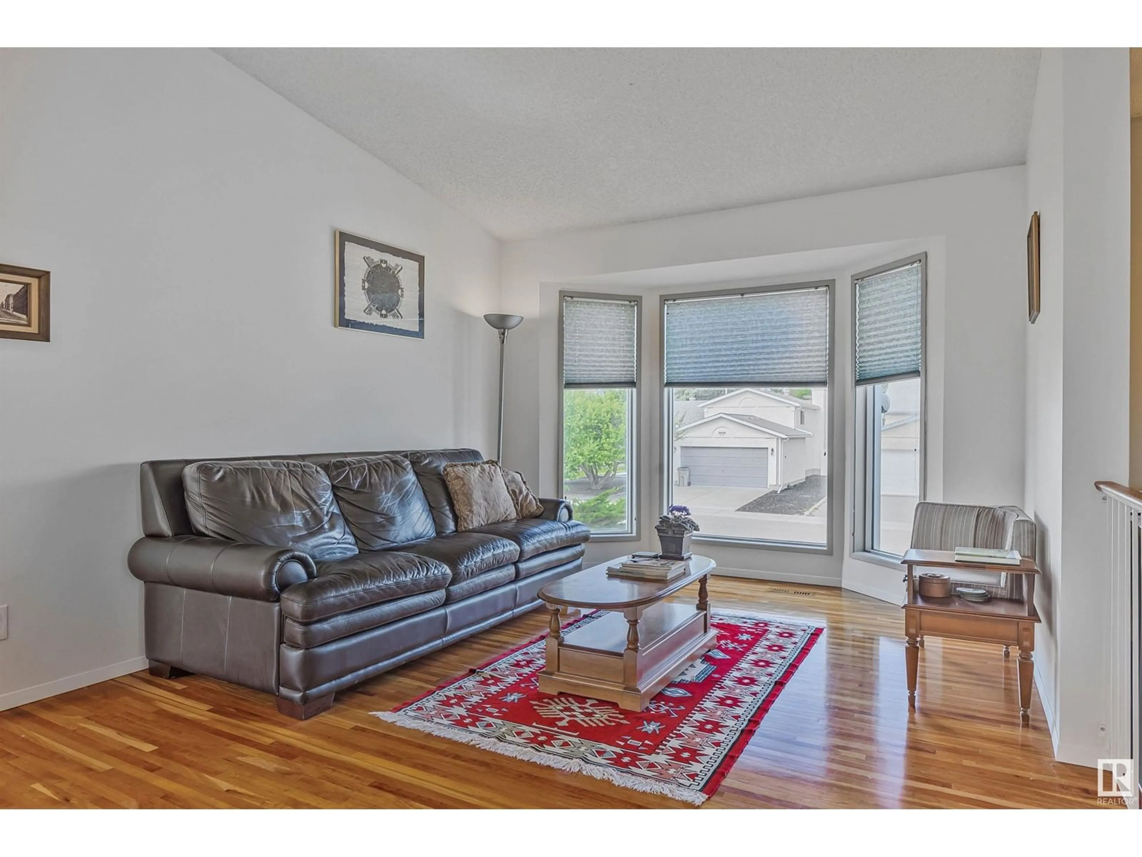 Living room with furniture, wood/laminate floor for 5611 56 ST, Beaumont Alberta T4X1A6