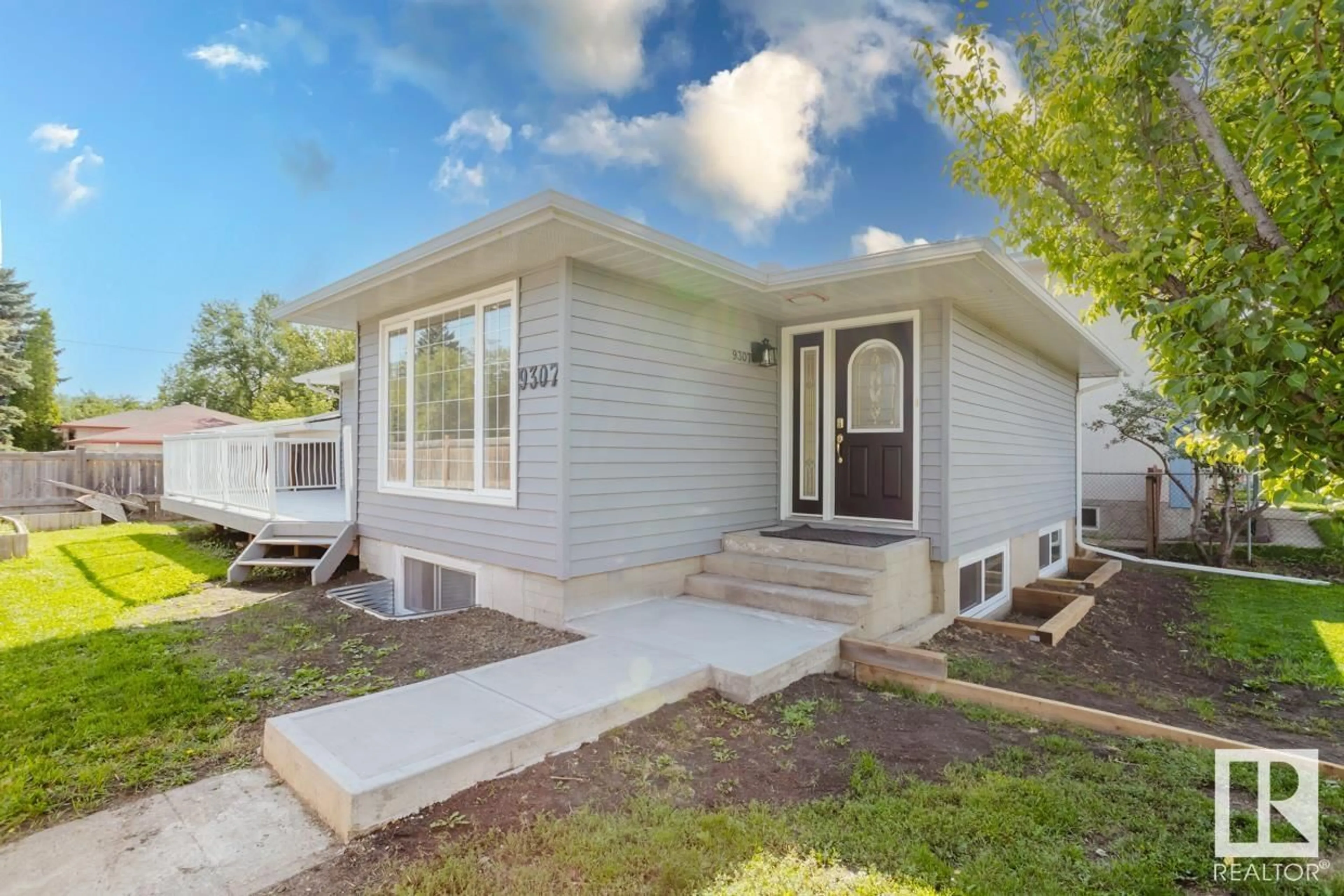 Home with vinyl exterior material, street for 9307 128 AV, Edmonton Alberta T5E0H3