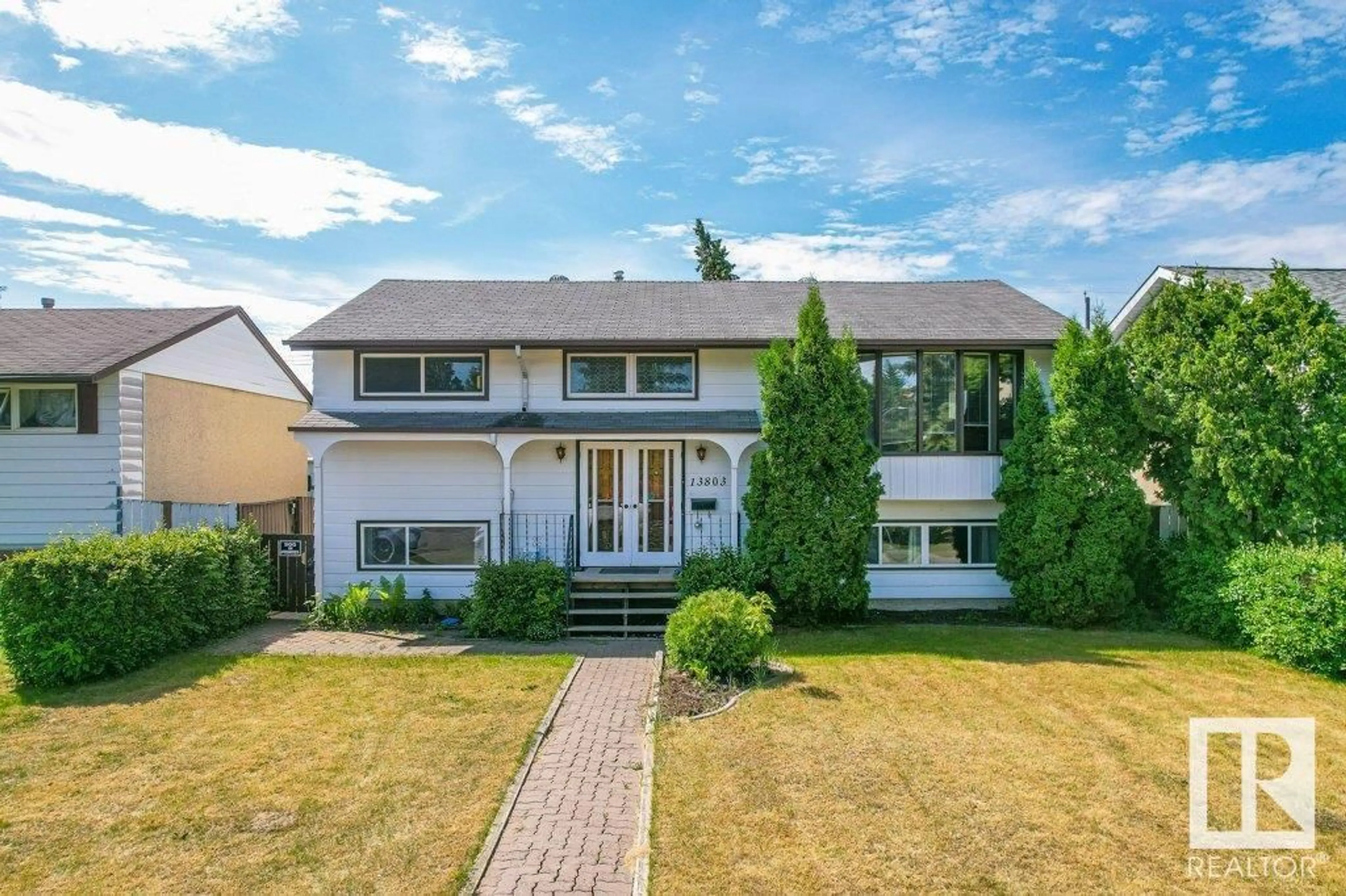 Home with vinyl exterior material, street for 13803 133 AV, Edmonton Alberta T5L3T3