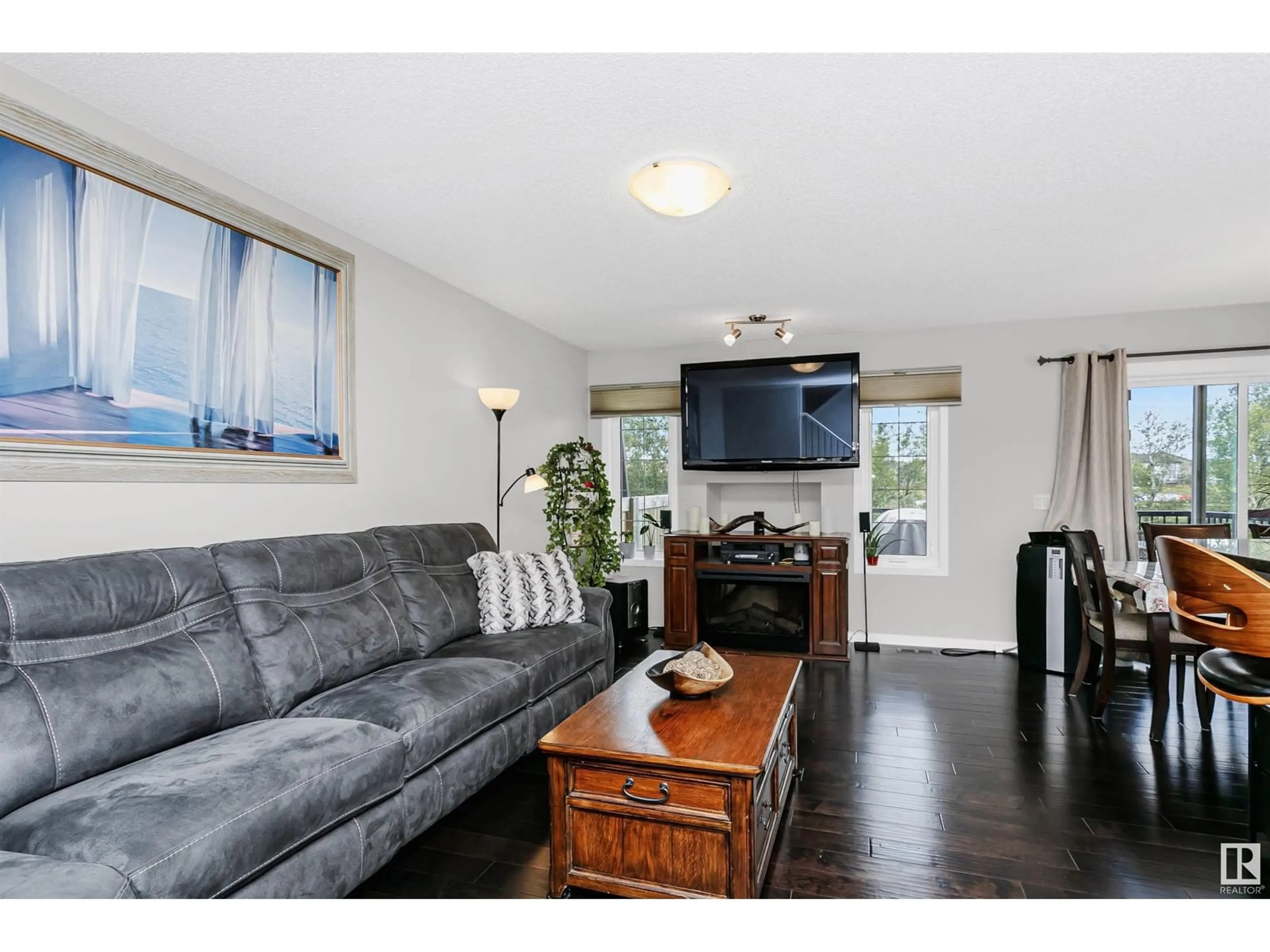 Living room with furniture, wood/laminate floor for 12306 173A AV, Edmonton Alberta T5X0J8