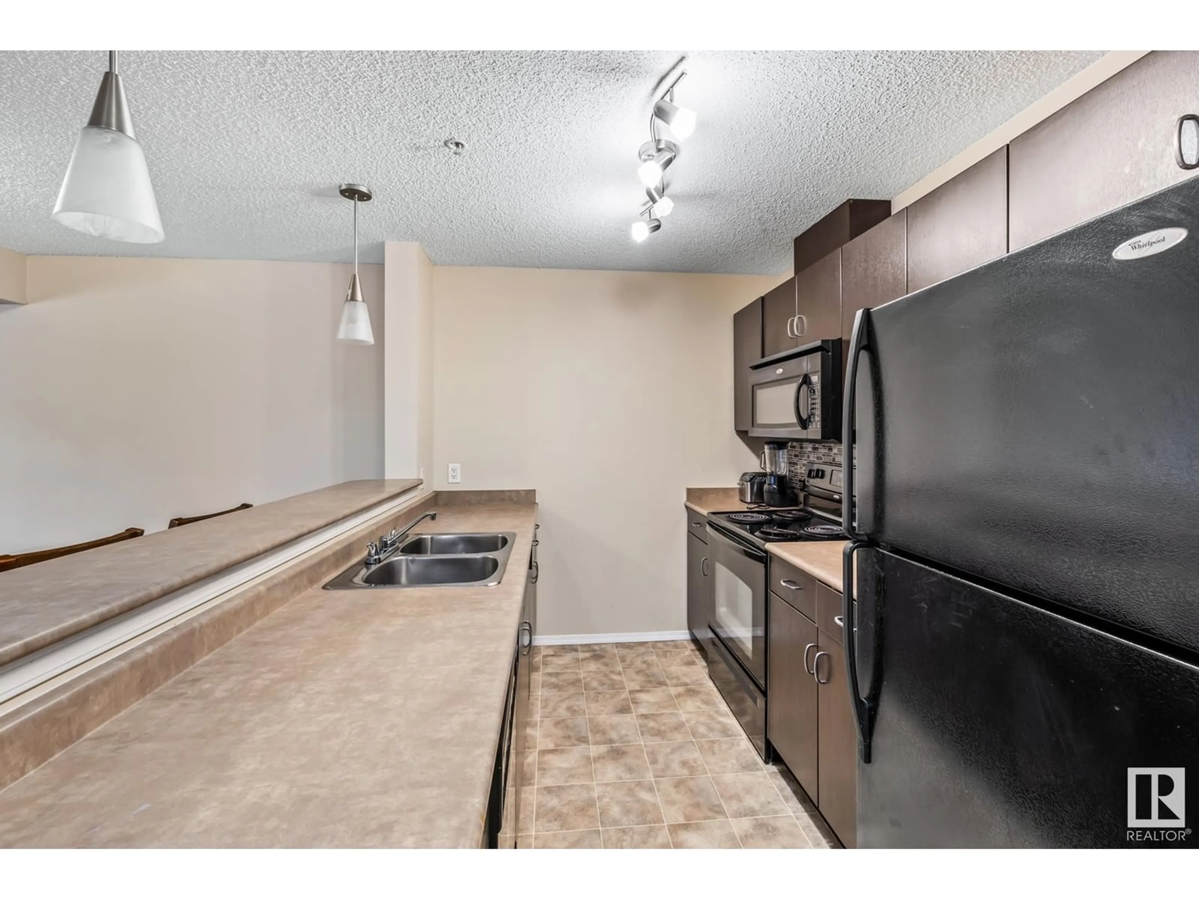Standard kitchen, unknown for 204 - 1188 HYNDMAN RD, Edmonton Alberta T5A0E9