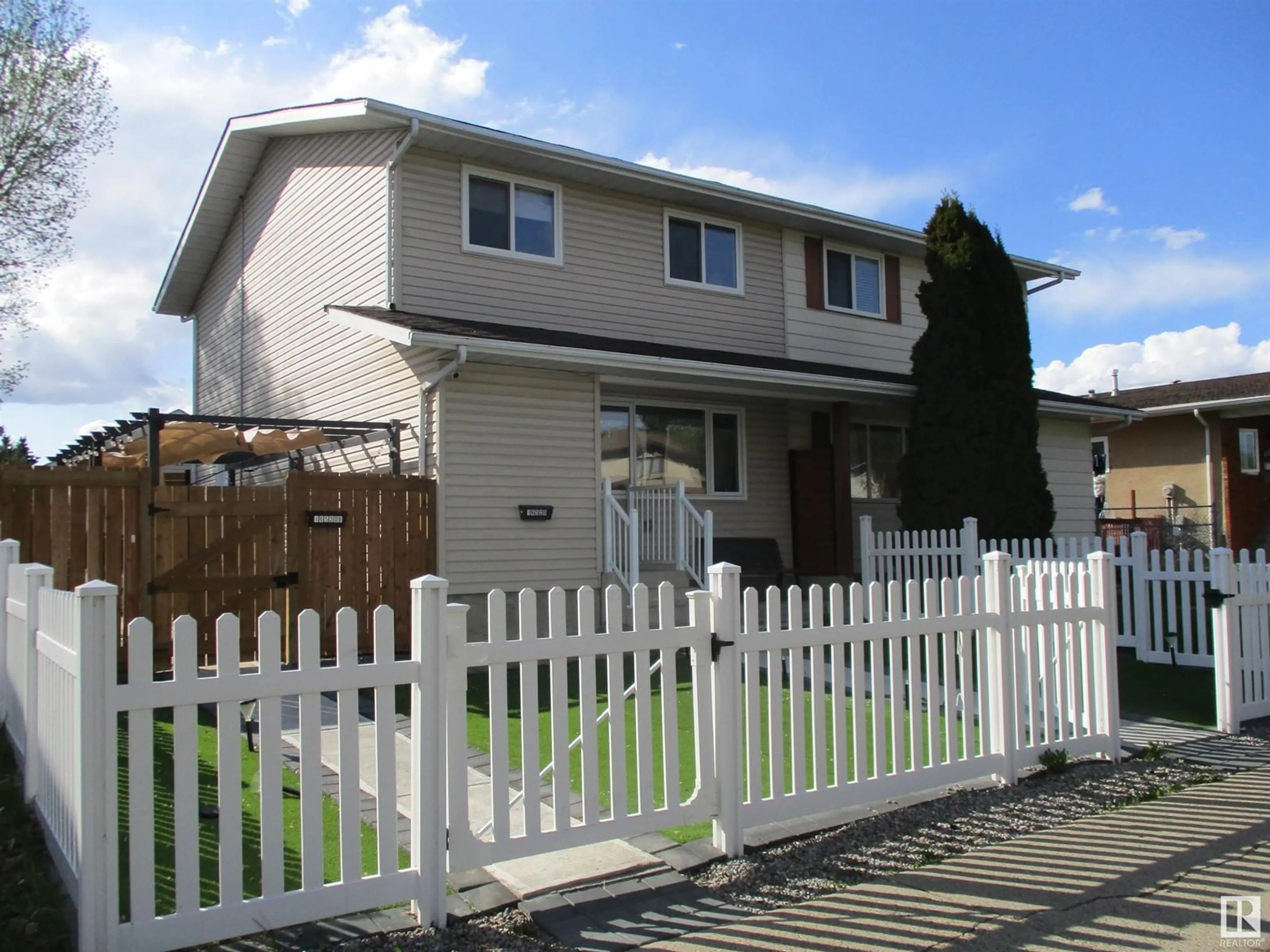 Home with vinyl exterior material, street for NW - 16520 115 ST, Edmonton Alberta T5X3V4