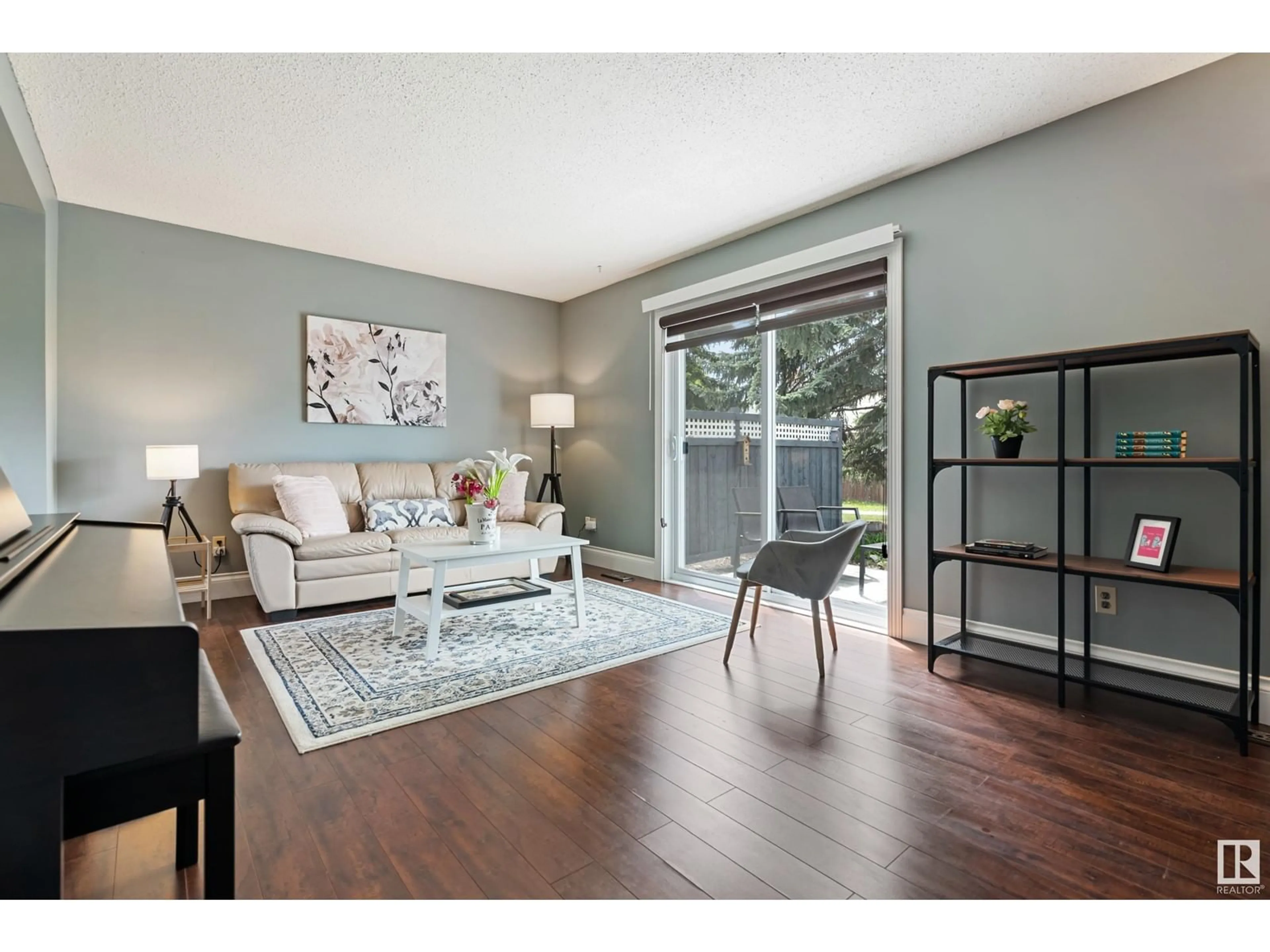 Living room with furniture, wood/laminate floor for 18452 62B AV NW, Edmonton Alberta T5T2N7