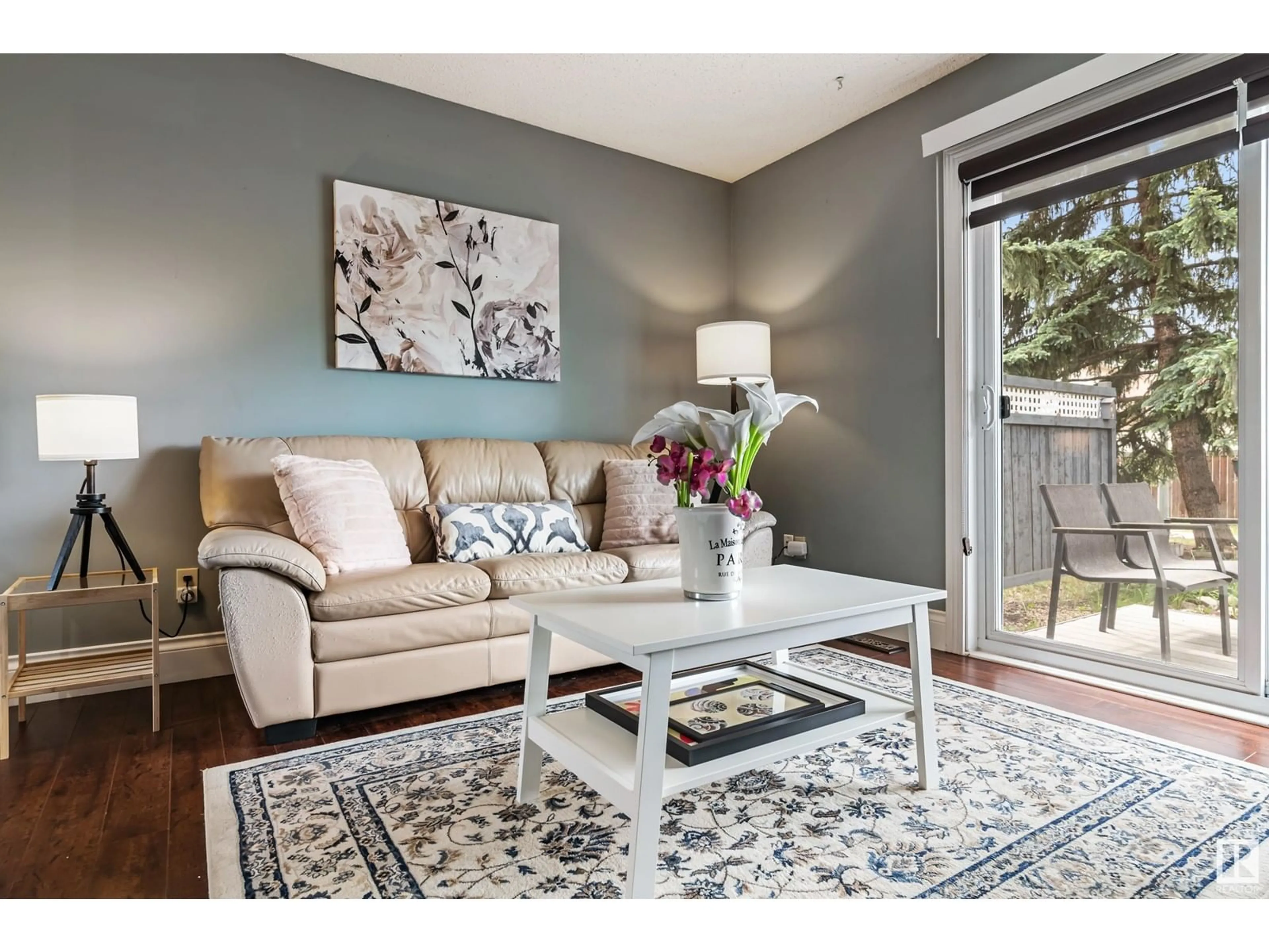 Living room with furniture, wood/laminate floor for 18452 62B AV NW, Edmonton Alberta T5T2N7