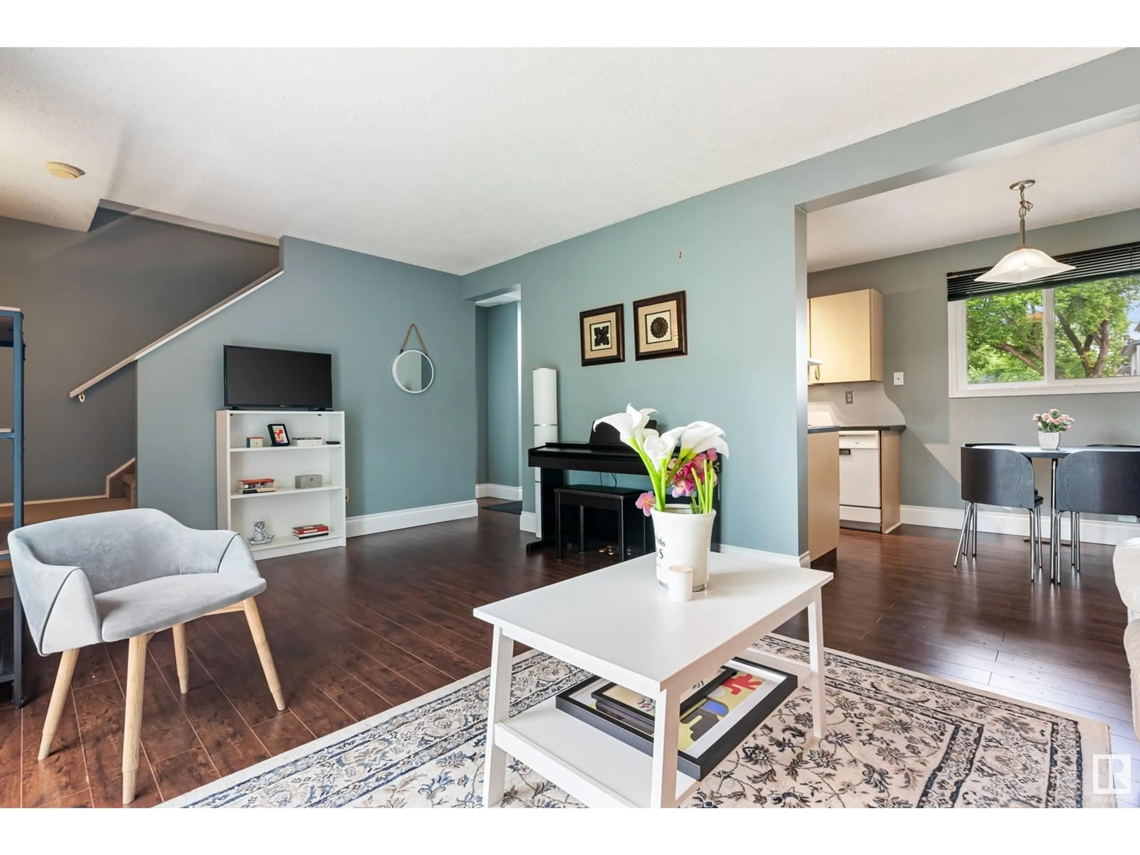 Living room with furniture, wood/laminate floor for 18452 62B AV NW, Edmonton Alberta T5T2N7