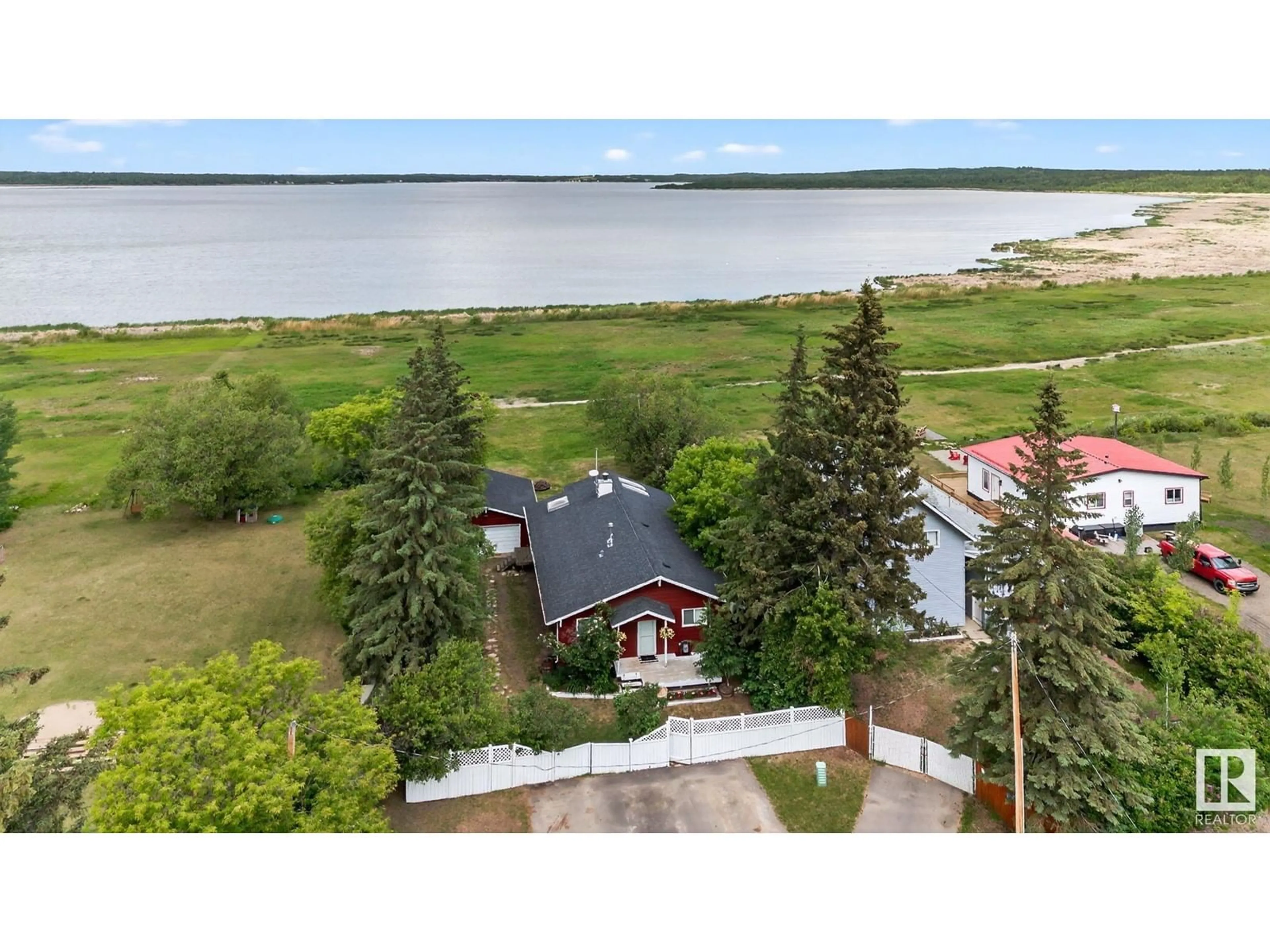 A pic from outside/outdoor area/front of a property/back of a property/a pic from drone, water/lake/river/ocean view for 508 - 55230 RGE ROAD 10, Rural Sturgeon County Alberta T8R0K4