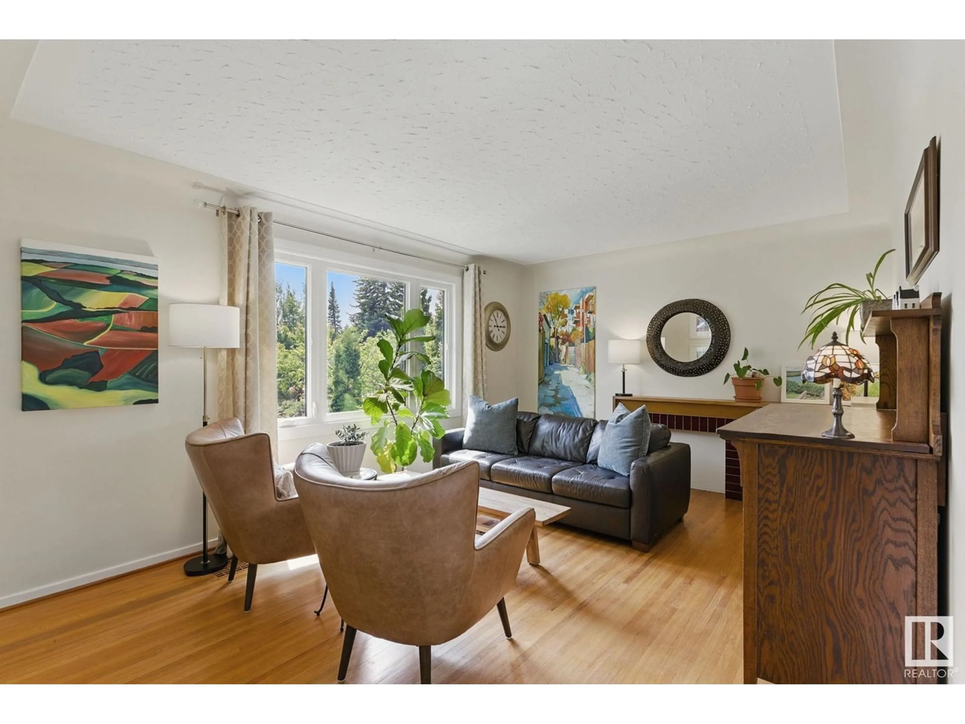 Living room with furniture, wood/laminate floor for 14004 106A AV, Edmonton Alberta T5N1E1