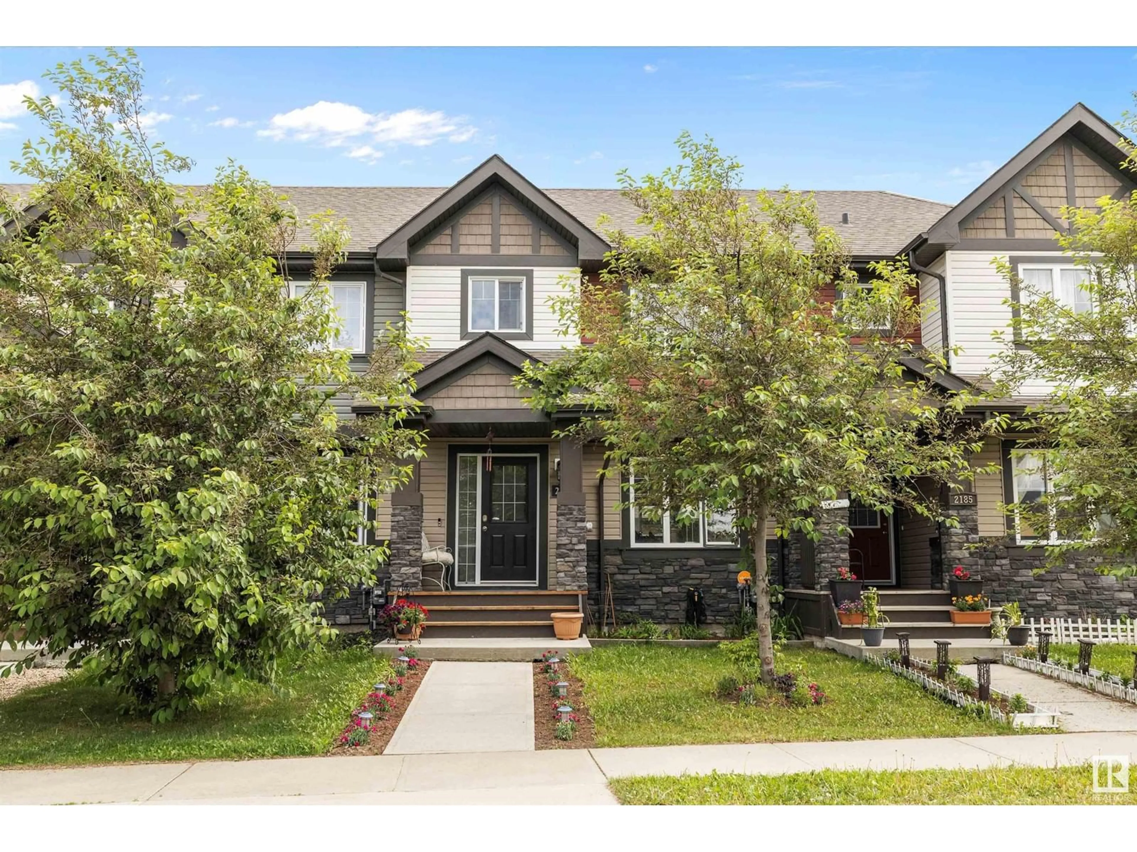 Home with brick exterior material, street for 2183 TRUMPETER WY, Edmonton Alberta T5S0K2