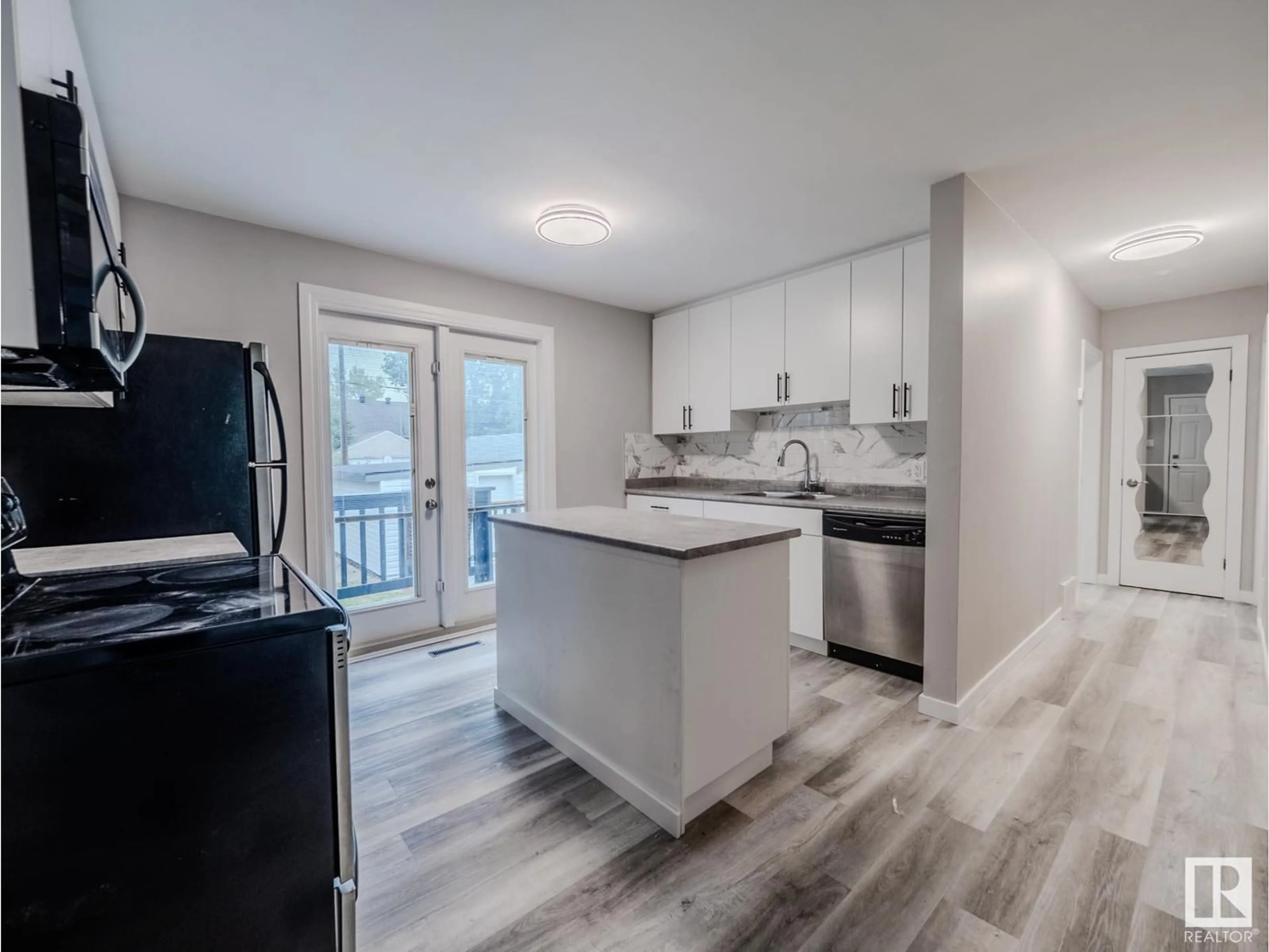 Open concept kitchen, unknown for 7740 76 AV, Edmonton Alberta T6C0H4