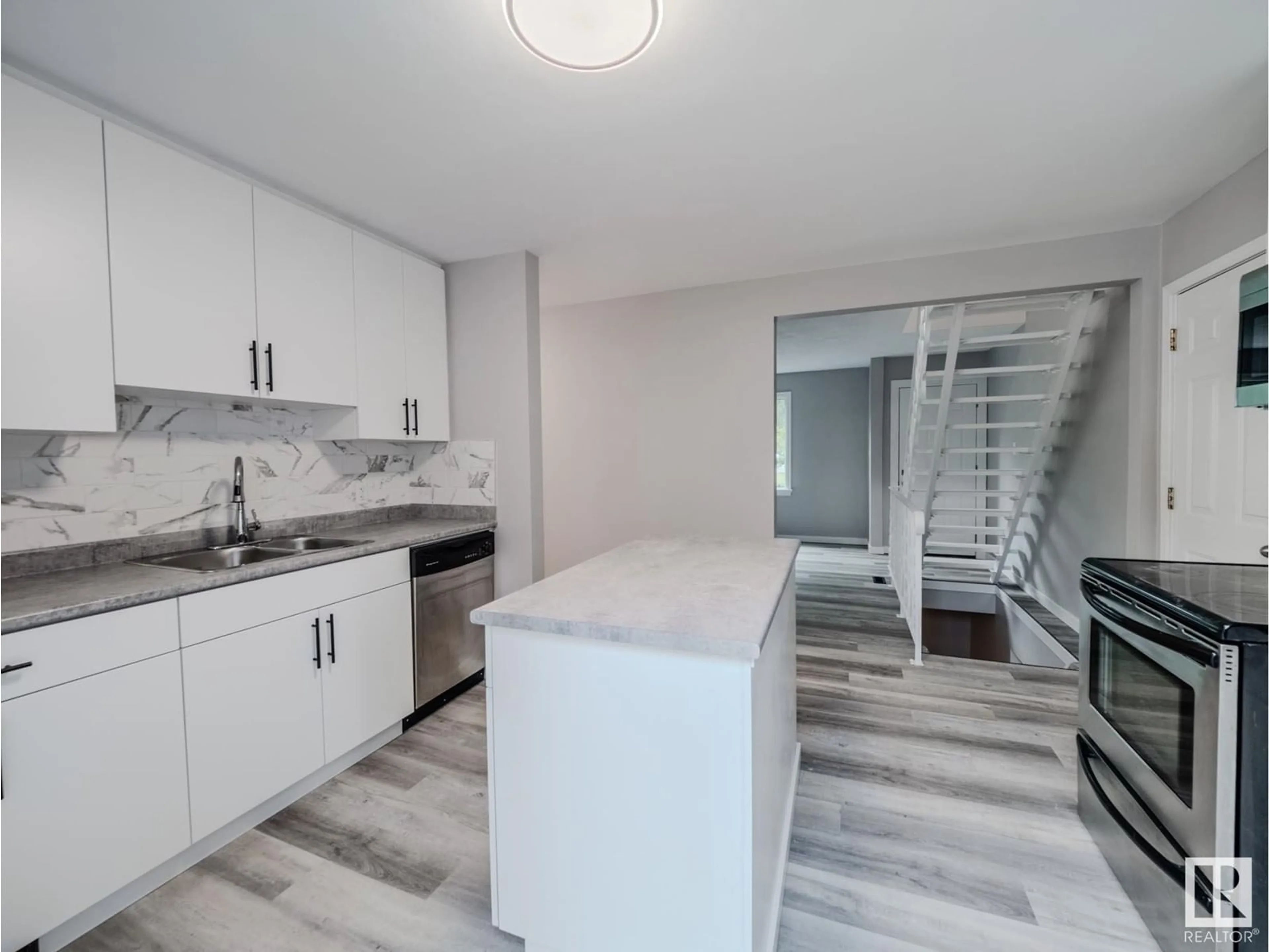Open concept kitchen, ceramic/tile floor for 7740 76 AV, Edmonton Alberta T6C0H4