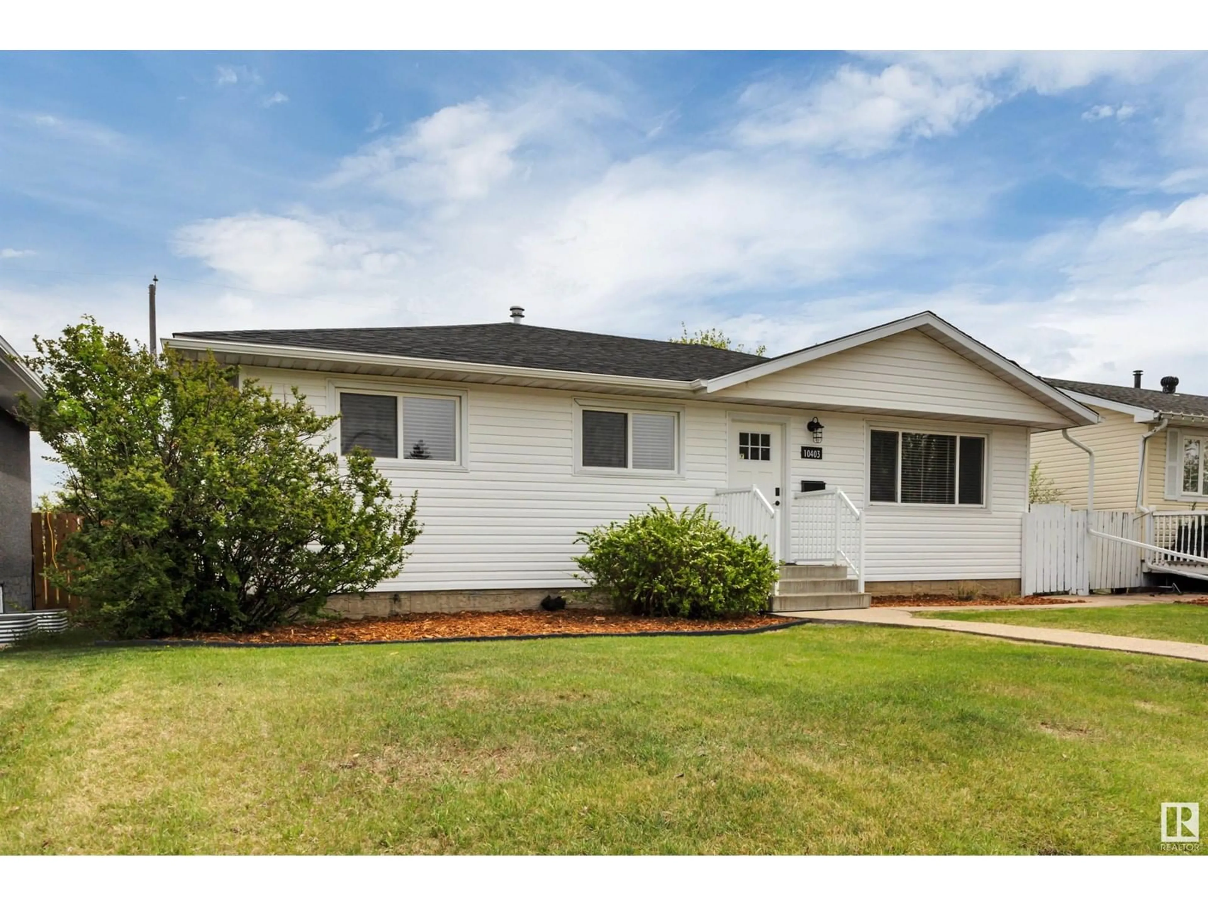 Home with vinyl exterior material, street for 10403 42 ST, Edmonton Alberta T6A1T3