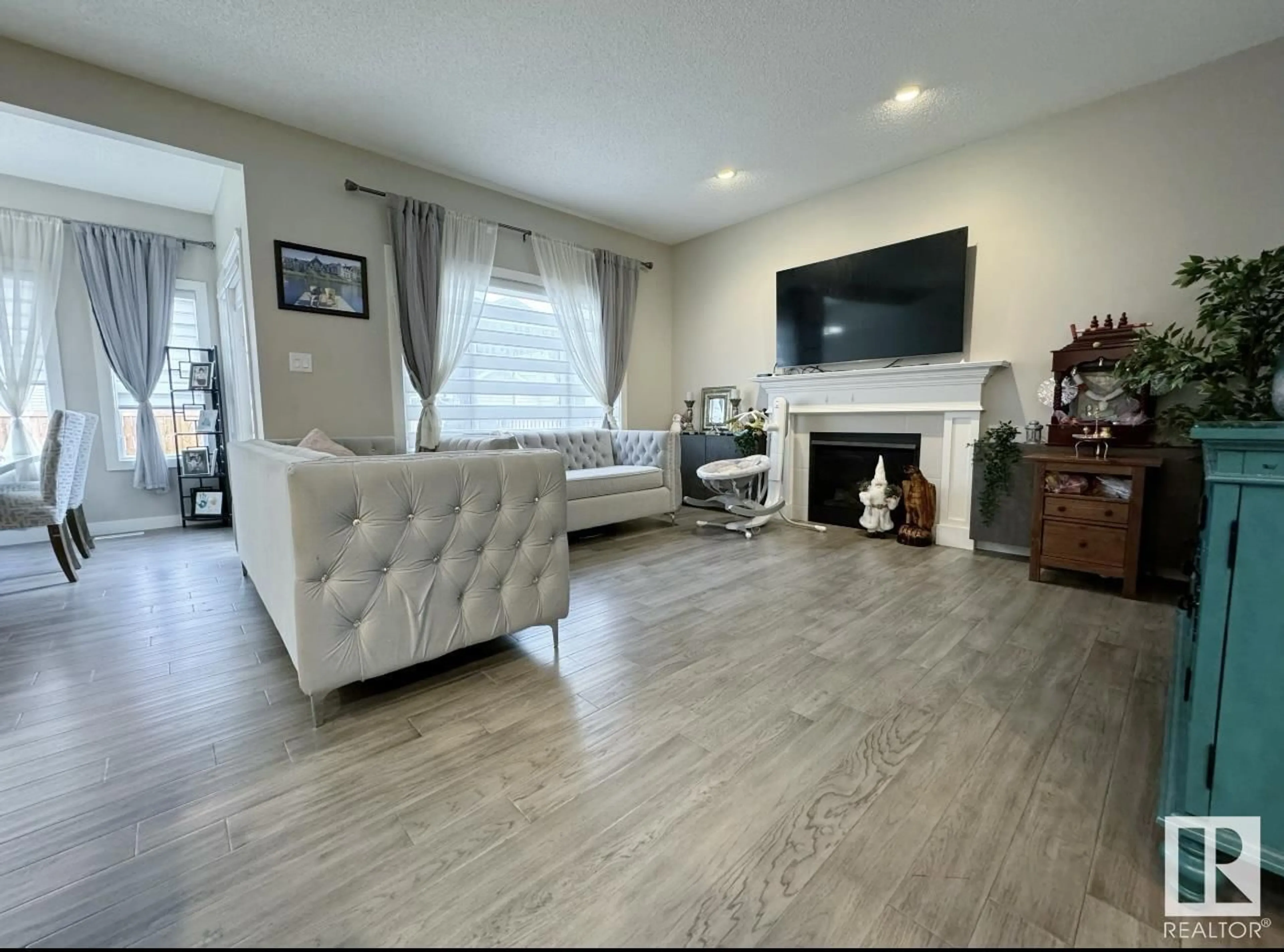 Living room with furniture, wood/laminate floor for 9663 224 ST, Edmonton Alberta T5T7K6