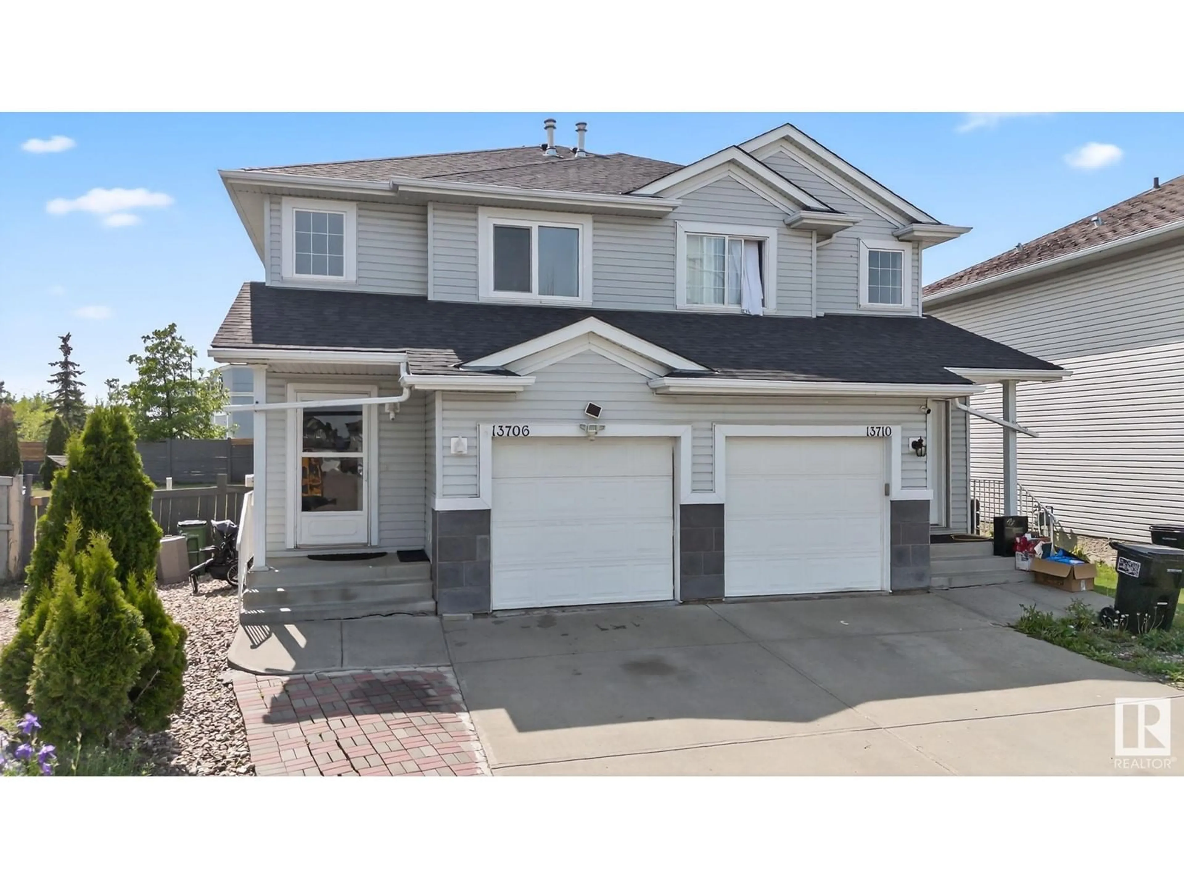 Home with vinyl exterior material, street for 13706 38 ST, Edmonton Alberta T5Y3G7