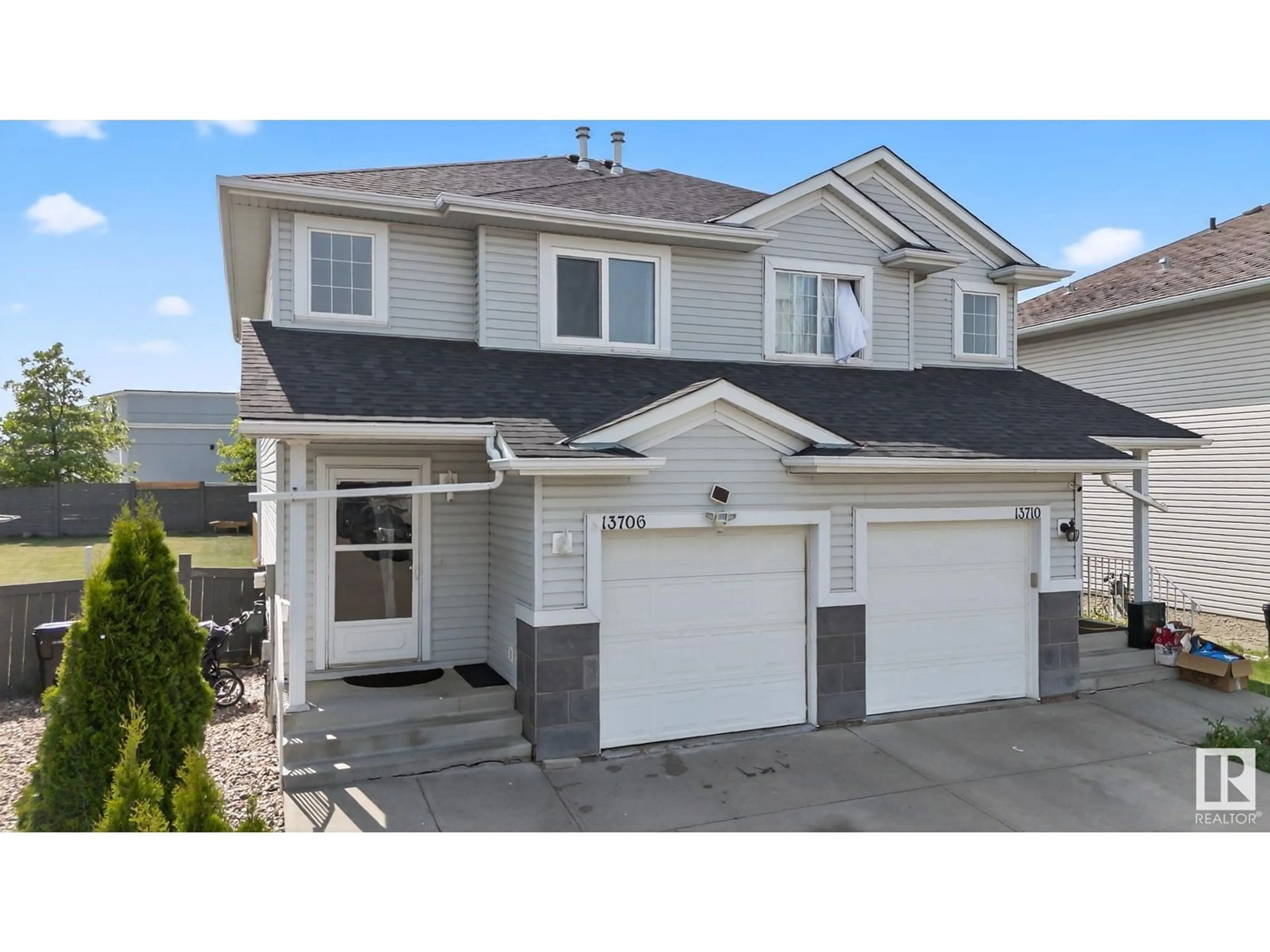Home with vinyl exterior material, street for 13706 38 ST, Edmonton Alberta T5Y3G7