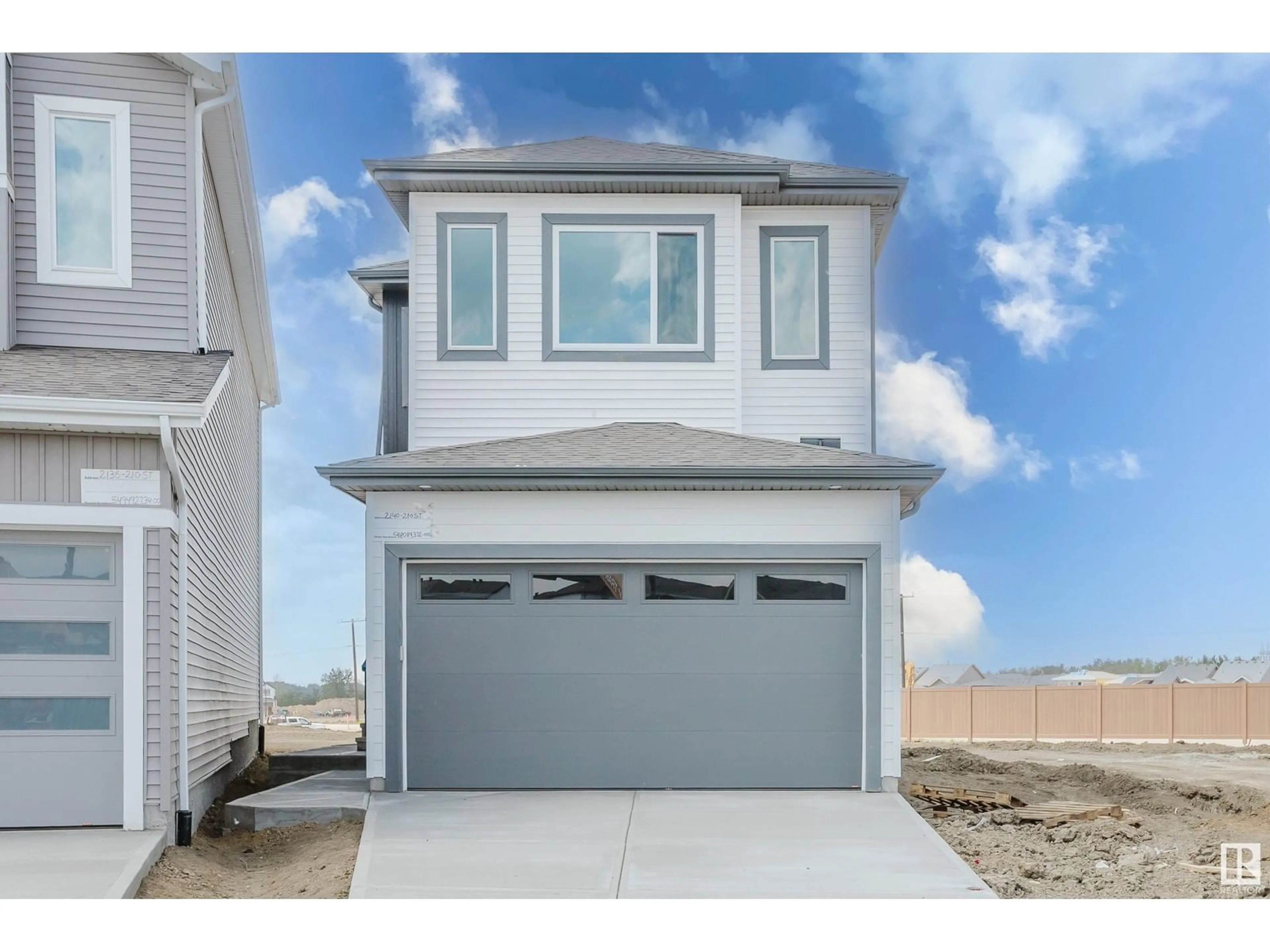 Home with vinyl exterior material, street for NW - 2140 210 ST, Edmonton Alberta T6M3H7