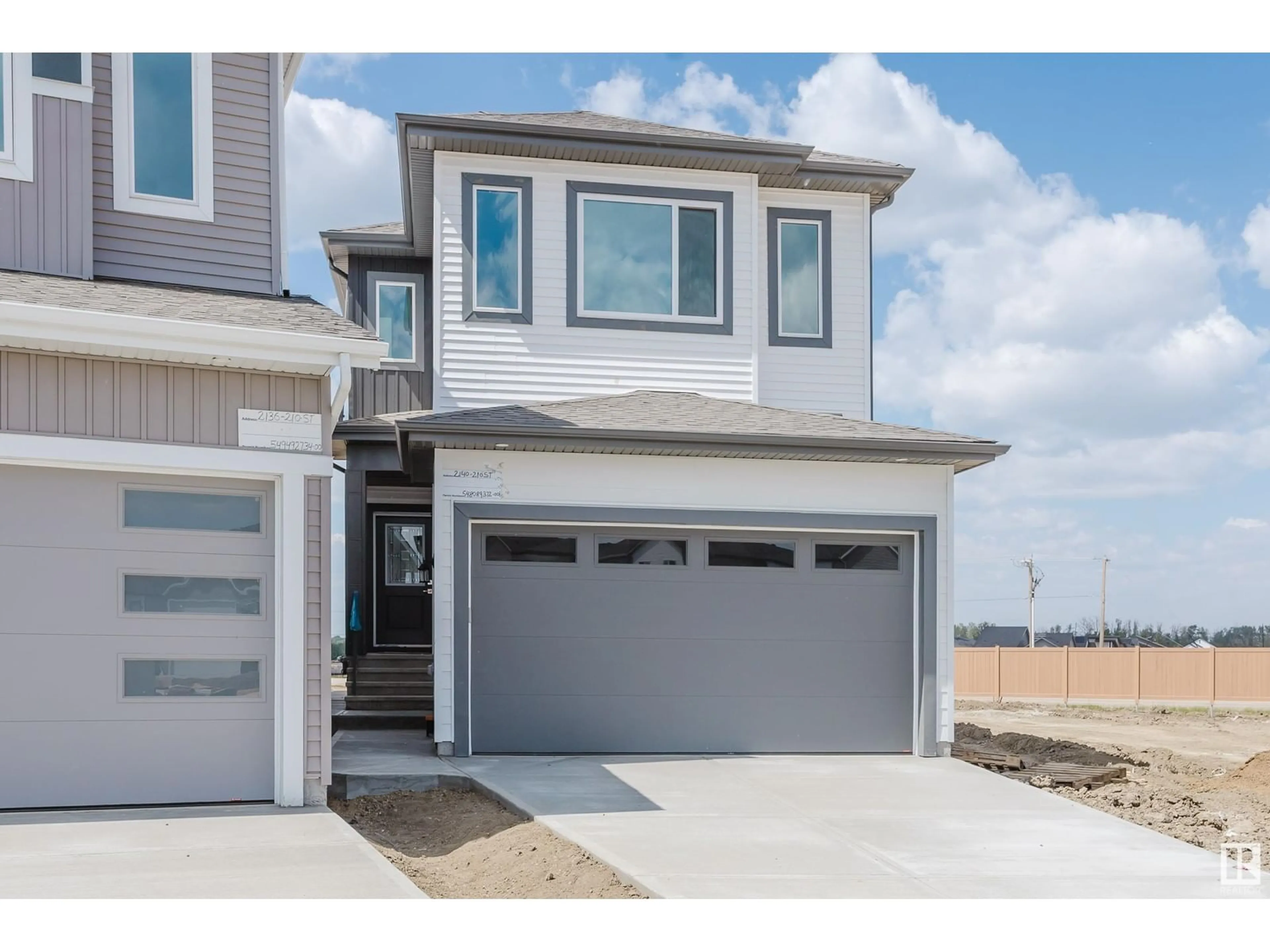 Home with vinyl exterior material, street for NW - 2140 210 ST, Edmonton Alberta T6M3H7