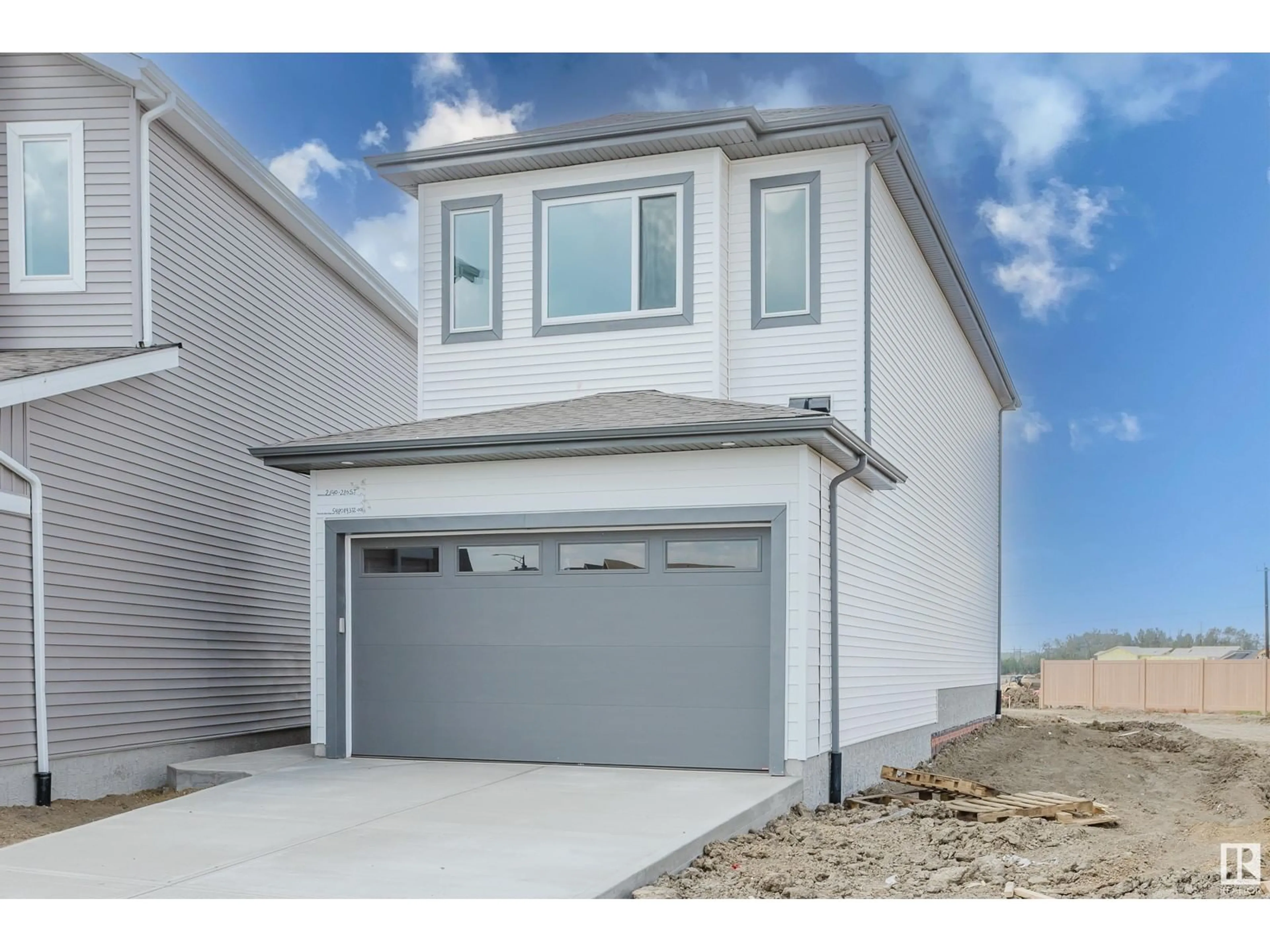 Home with vinyl exterior material, street for NW - 2140 210 ST, Edmonton Alberta T6M3H7