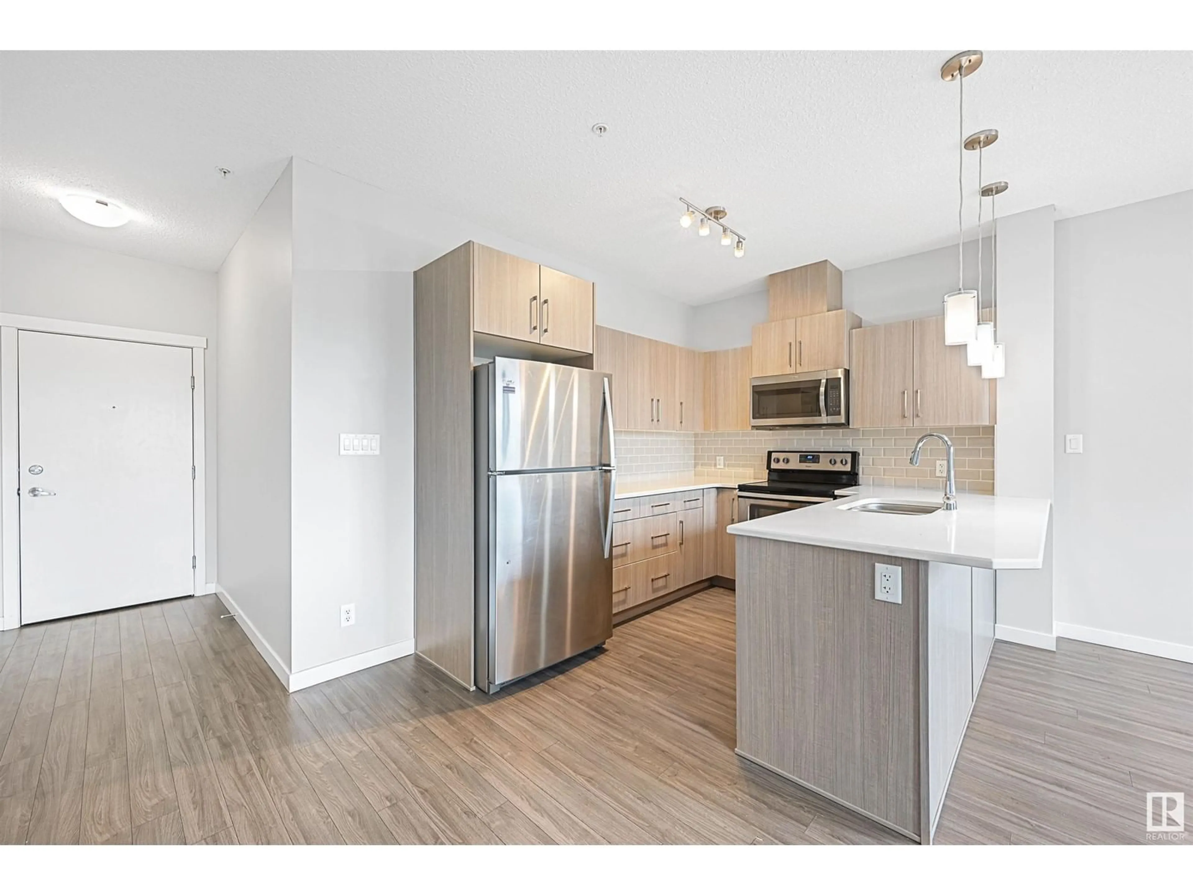 Open concept kitchen, wood/laminate floor for #310 - 812 WELSH DR, Edmonton Alberta T6X1Y7