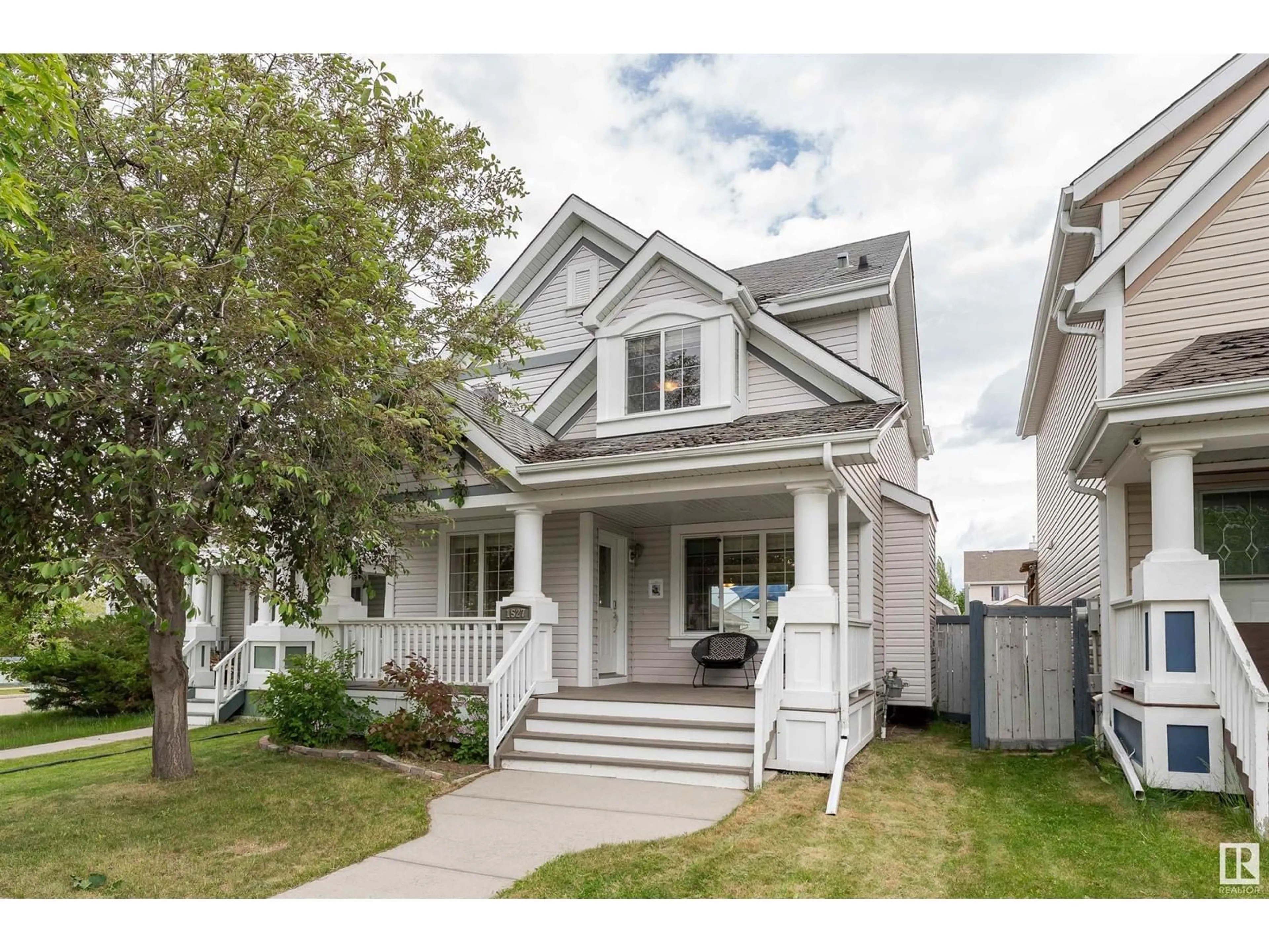 Home with vinyl exterior material, street for 1527 76 ST, Edmonton Alberta T6X1M3
