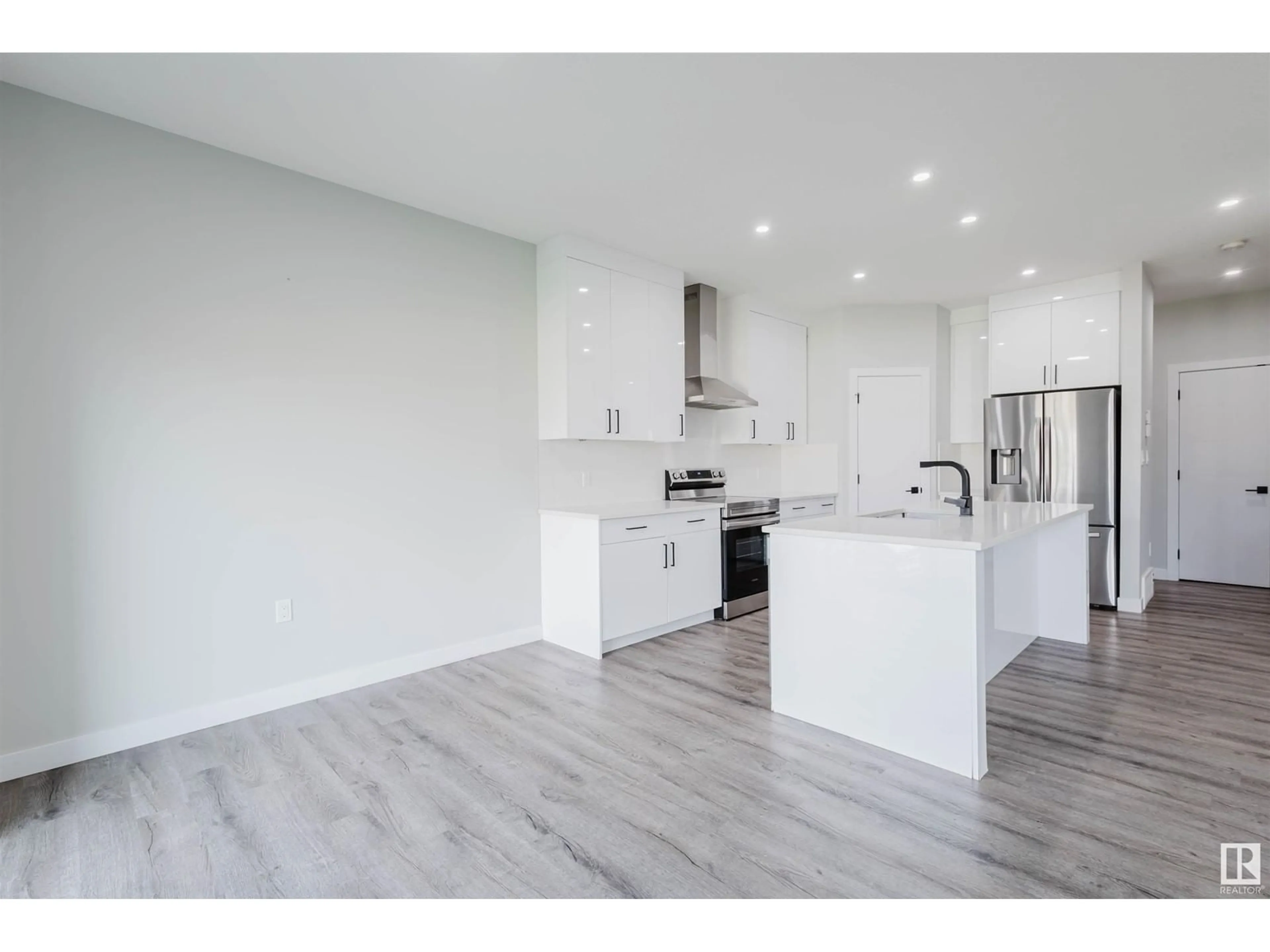 Open concept kitchen, wood/laminate floor for 5209 KIMBALL CRES, Edmonton Alberta T6W4Z2