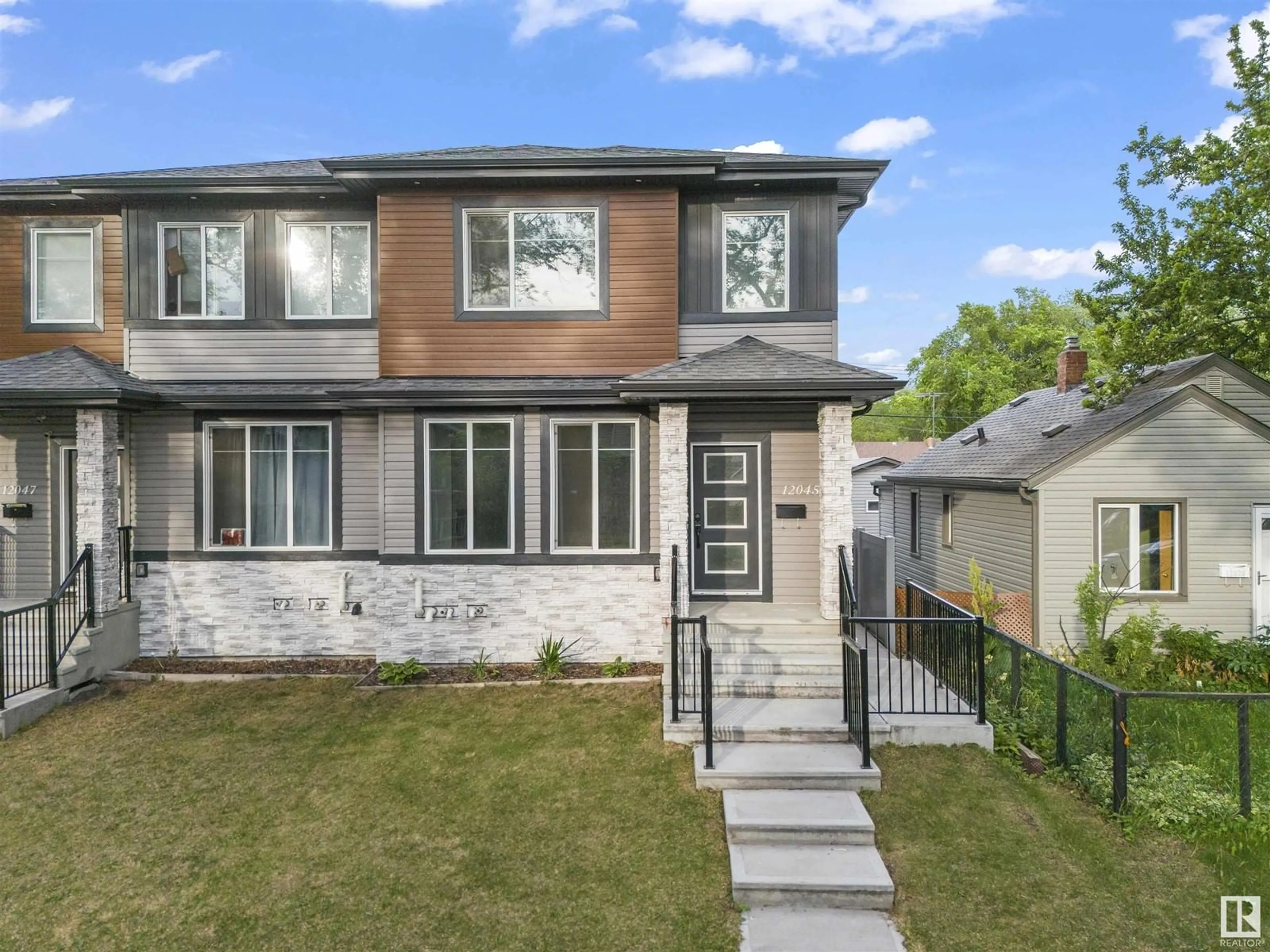 Home with vinyl exterior material, street for NW - 12045 65 ST, Edmonton Alberta T5W4L6