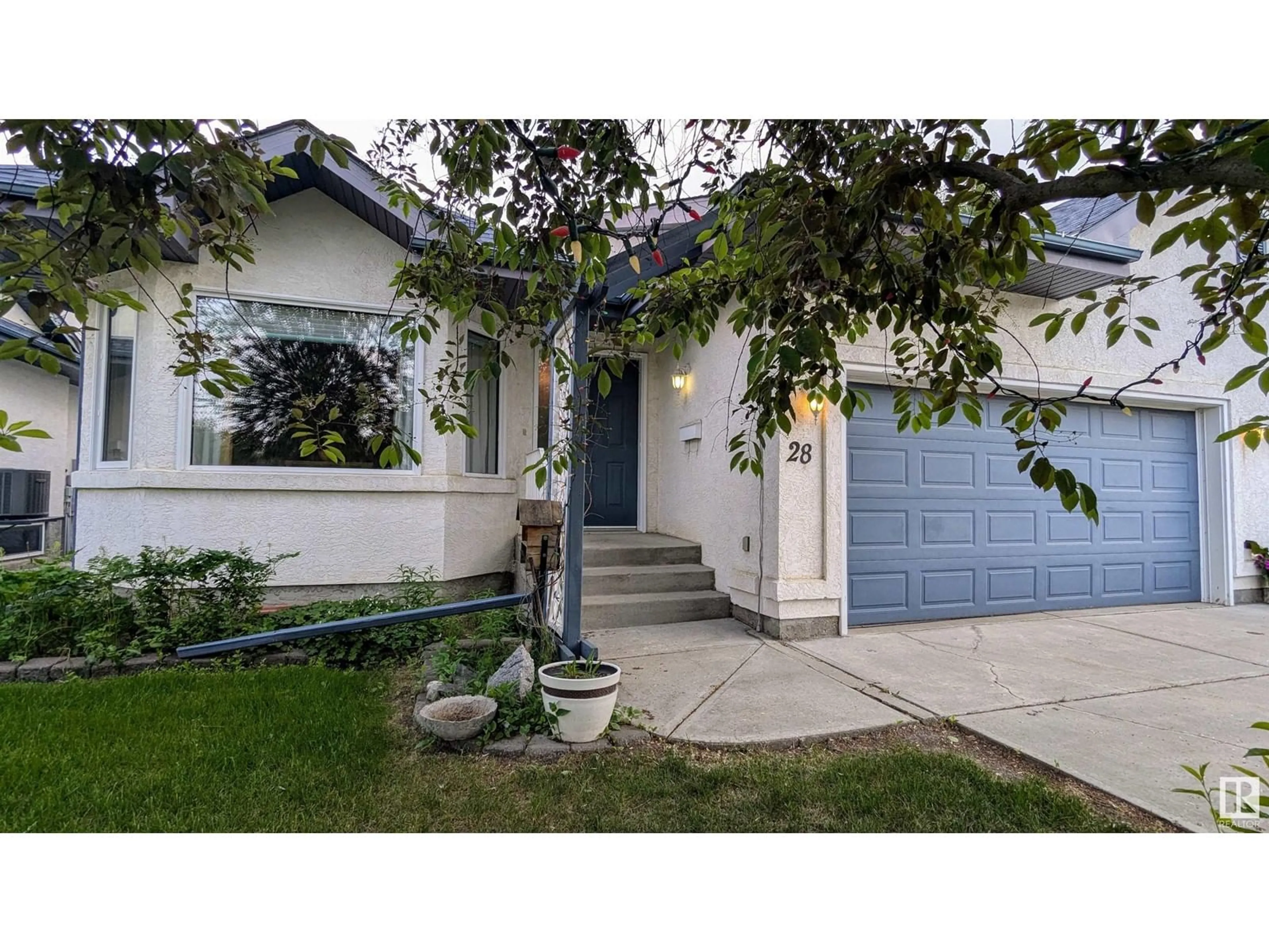 Home with vinyl exterior material, street for 8 - 28 DECHENE RD, Edmonton Alberta T9M2S5