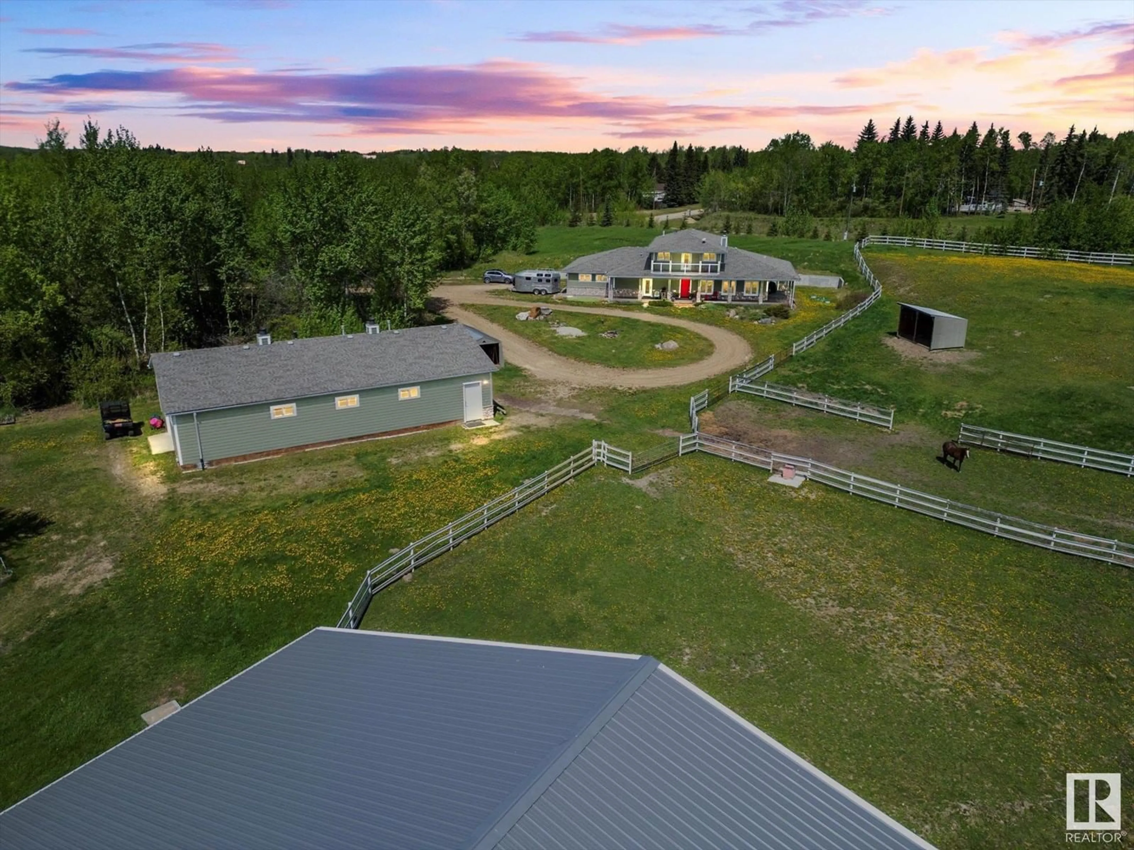 A pic from outside/outdoor area/front of a property/back of a property/a pic from drone, mountain view for 21031 TWP RD 530, Rural Strathcona County Alberta T8G2C7
